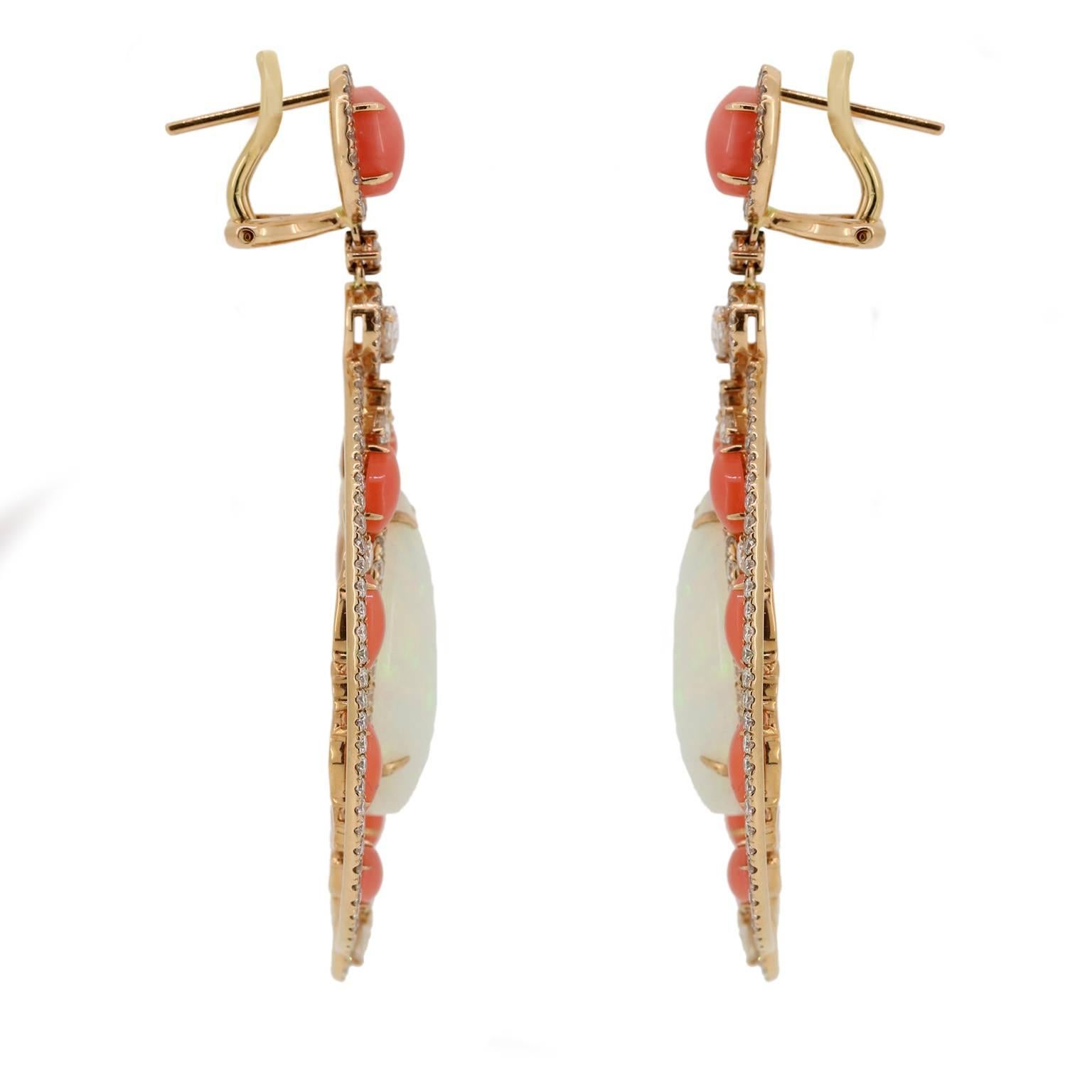 No need to take an exotic vacation when you can have these unique Ethiopian Opal, peach coral and diamond earrings at the comfort of your own home. 

Ethiopian Opal Approx. - 16.65cts
Natural Peach Coral Approx. - 6.67cts
Diamonds Approx.-