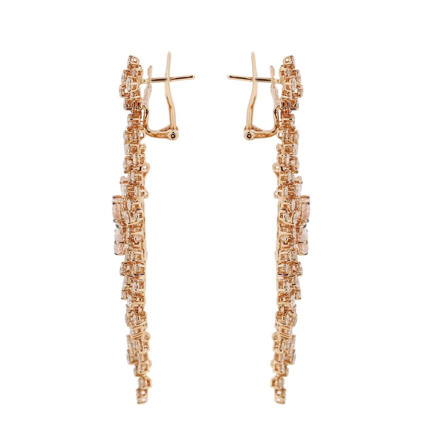 Ready for a black-tie affair? These are the earrings to have!  4.02 carats of Morganite that is in a floral motif surrounded by 7.82 carats of full cut diamonds. Post / Clip

Length - 69mm
Width - 27mm