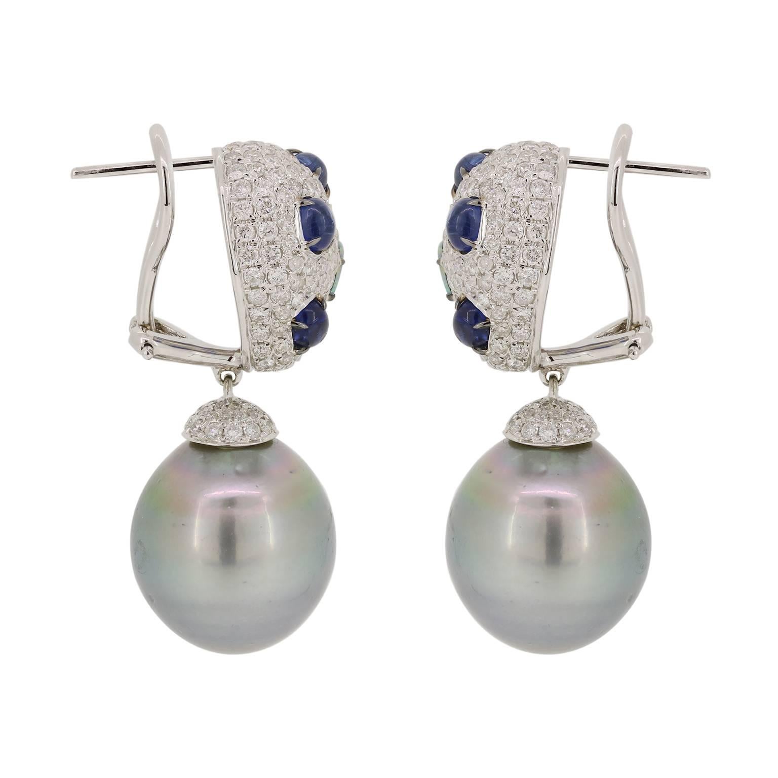Classic and elegant with a flair!  We have updated the classic pearl drop earring with adding Blue Opal and Kyanite to a white diamond pave top for a unique twist. These are finished off with a gray Tahitian pearl drop (15mm) with a white diamond
