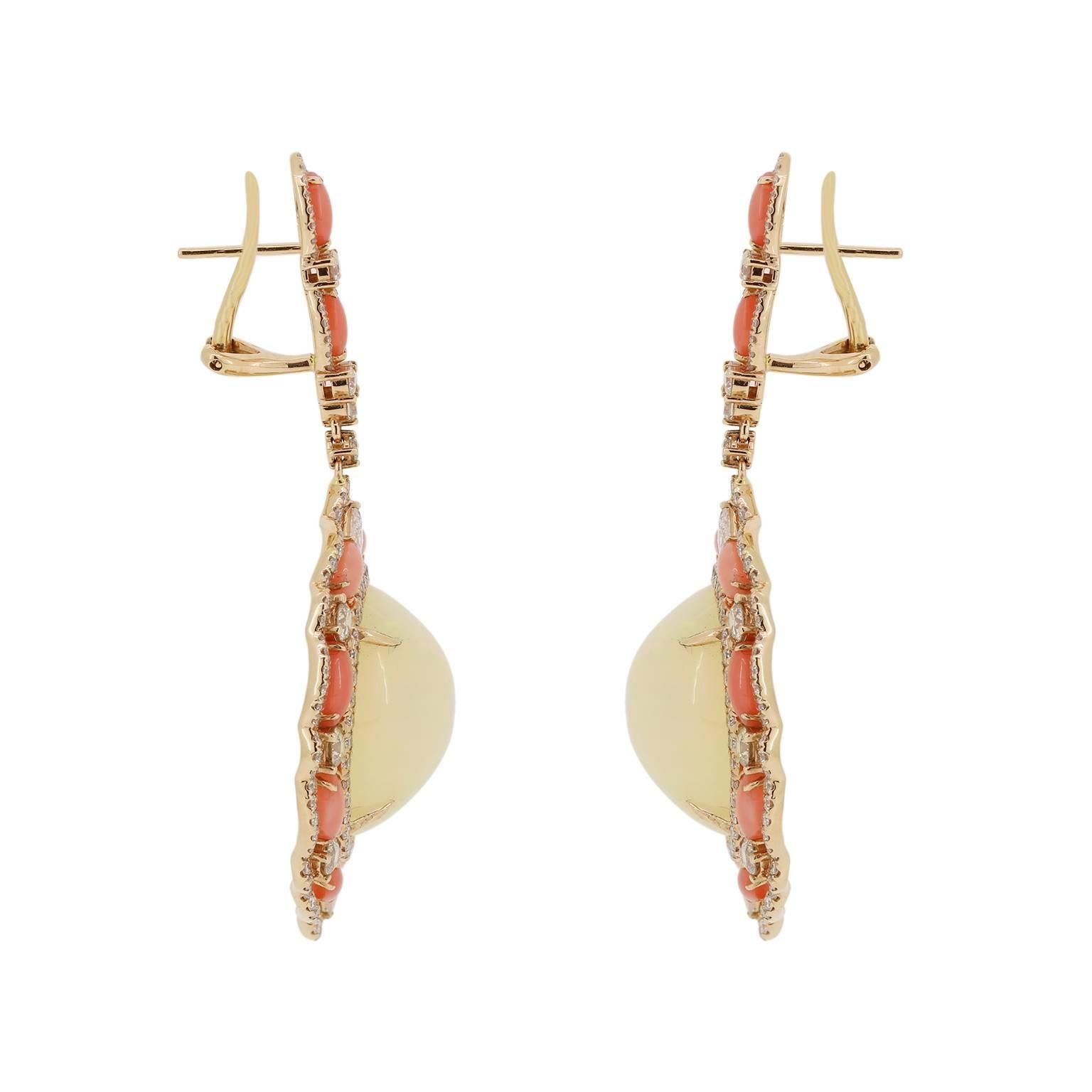 These 18k yellow gold exotic earrings are sure to put a smile on your face.  There are two large oval Ethiopian opals at a total carat weight of 31.20. They are framed with natural peach coral and diamond accents to highlight the beauty of the