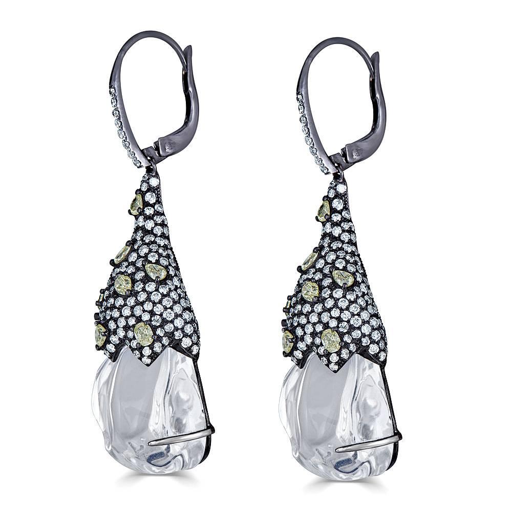 These unique white opal drop earrings are sure to put a smile on your face.  Encrusted with white diamond onto the cap with yellow pear shape diamonds scattered throughout.   Leverback 

Diamond approx. - 3.79tcw
Yellow Pear Shape Diamond approx -