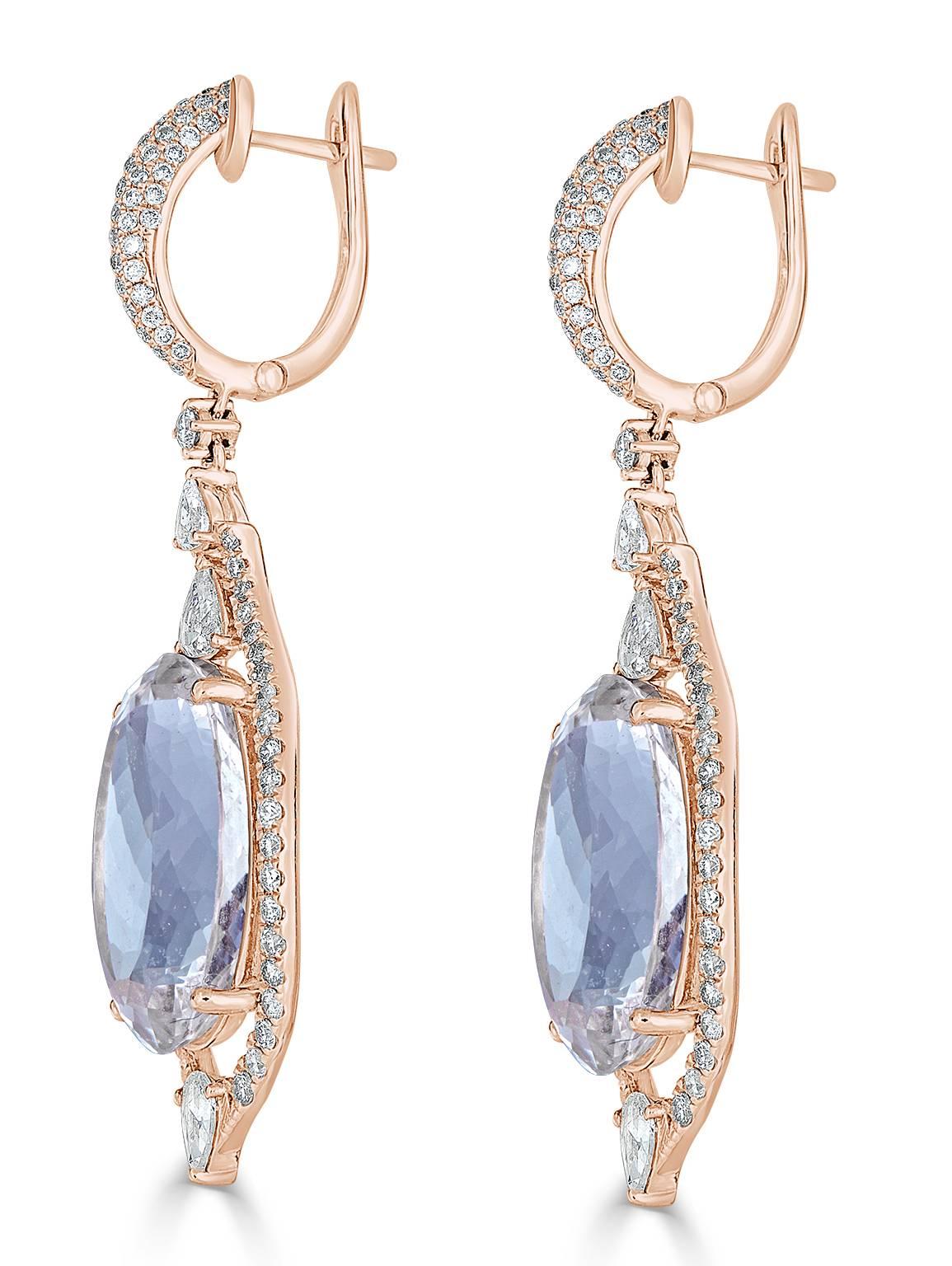 Simple elegance!  These fabulously charming Aquamarine drop earrings that are surrounded by 1.63 carats of white diamond pave all the way to the top of the earring have white pear shape diamonds sprinkled around the setting.  6 to be exact at