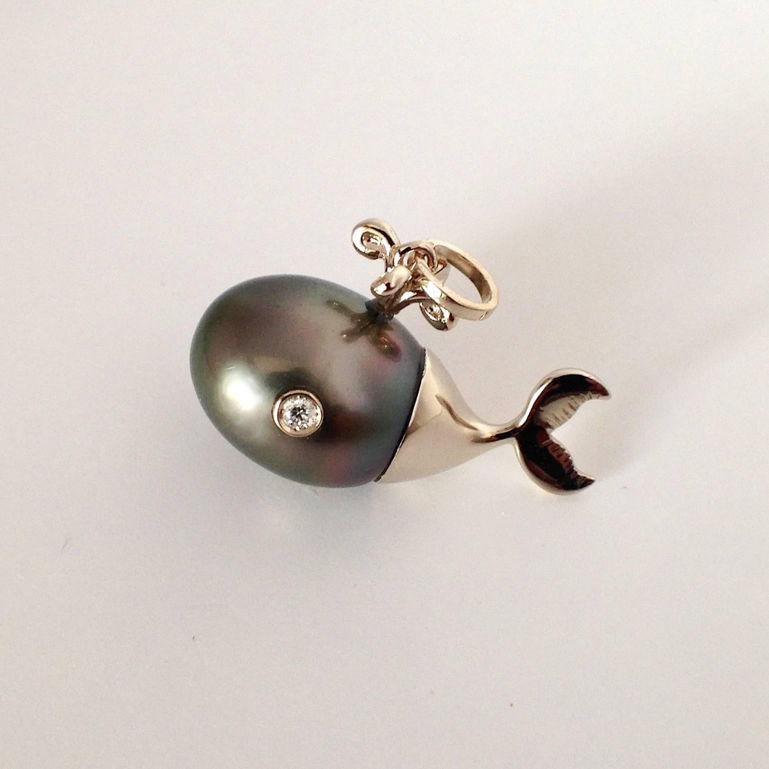 A beautifully hand crafted pendant in white gold in the form of a whale whit two diamond for the eyes, in total 0.07 ct. The Tahiti pearl is oval, about 13x15 mm