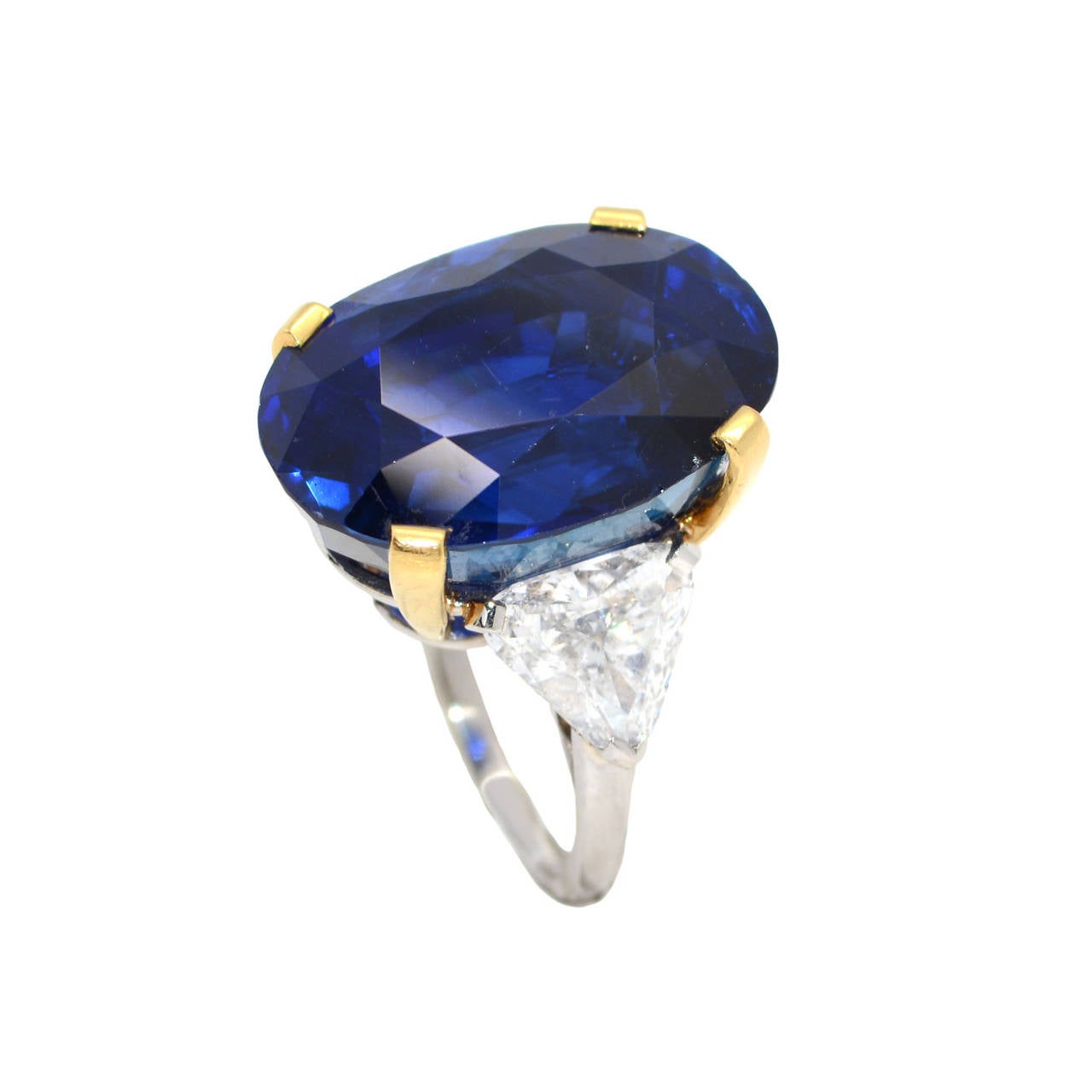 Signed Bulgari, 1980s. The huge blue velvet sapphire with a total weight of 34.09 carats. On the sides triangular cut diamond. Attached a Gubelin Certificate that attests that the sapphire has not been heated. This lot for sale with Customer to