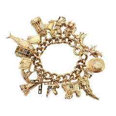 A 1960s Gem Set Gold Charm Bracelet