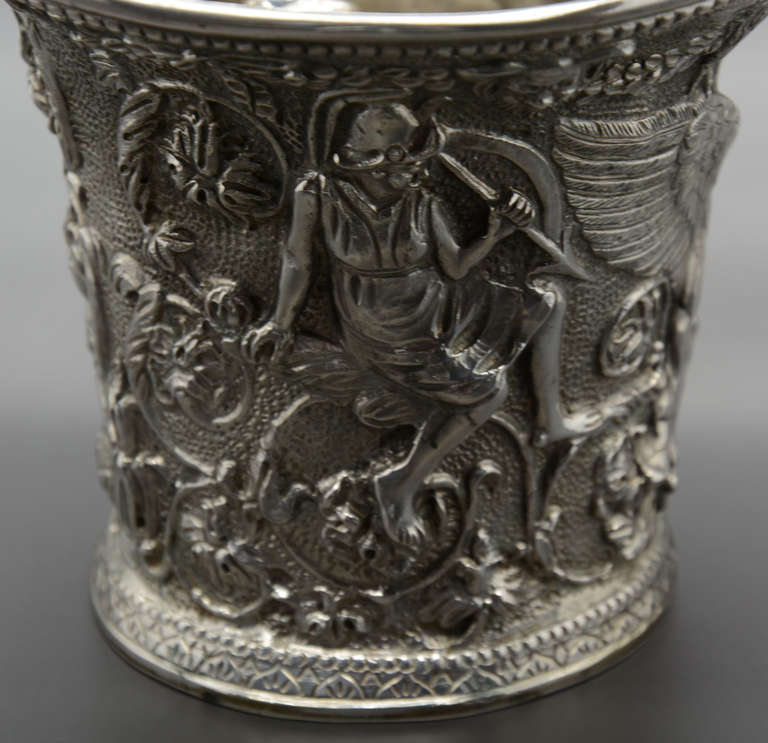 Silver 800/1000. Firmed F De Luca, Delmar, Napoli. Decorated with mythological scenes. Height 11 cm, the pestle 16.5 cm. Total weight circa 1.390 g.