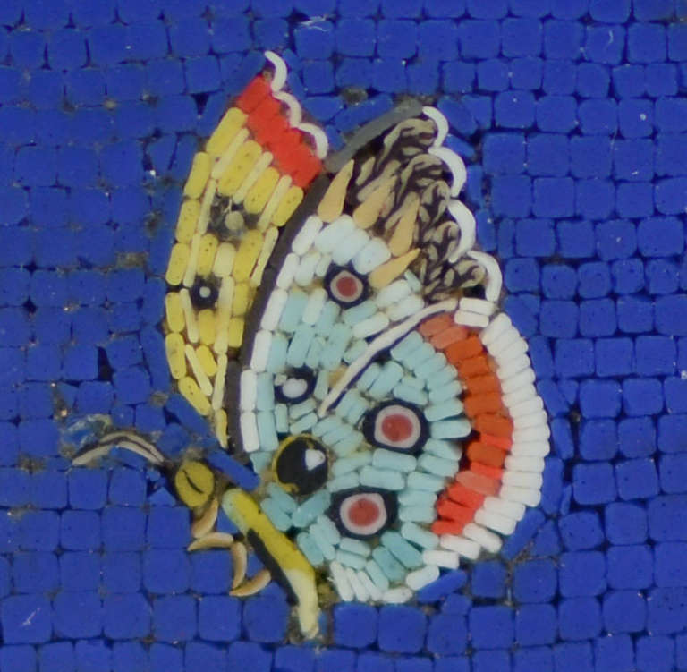 Artist of the micromosaic Maurizio Floravanti for Massoni. Octagonal. The sides openwork in yellow gold 18K, set with diamonds with a total weight of 2.73 carats. A circular plaque with micromosaic decoration of butterflies on a blue ground, set