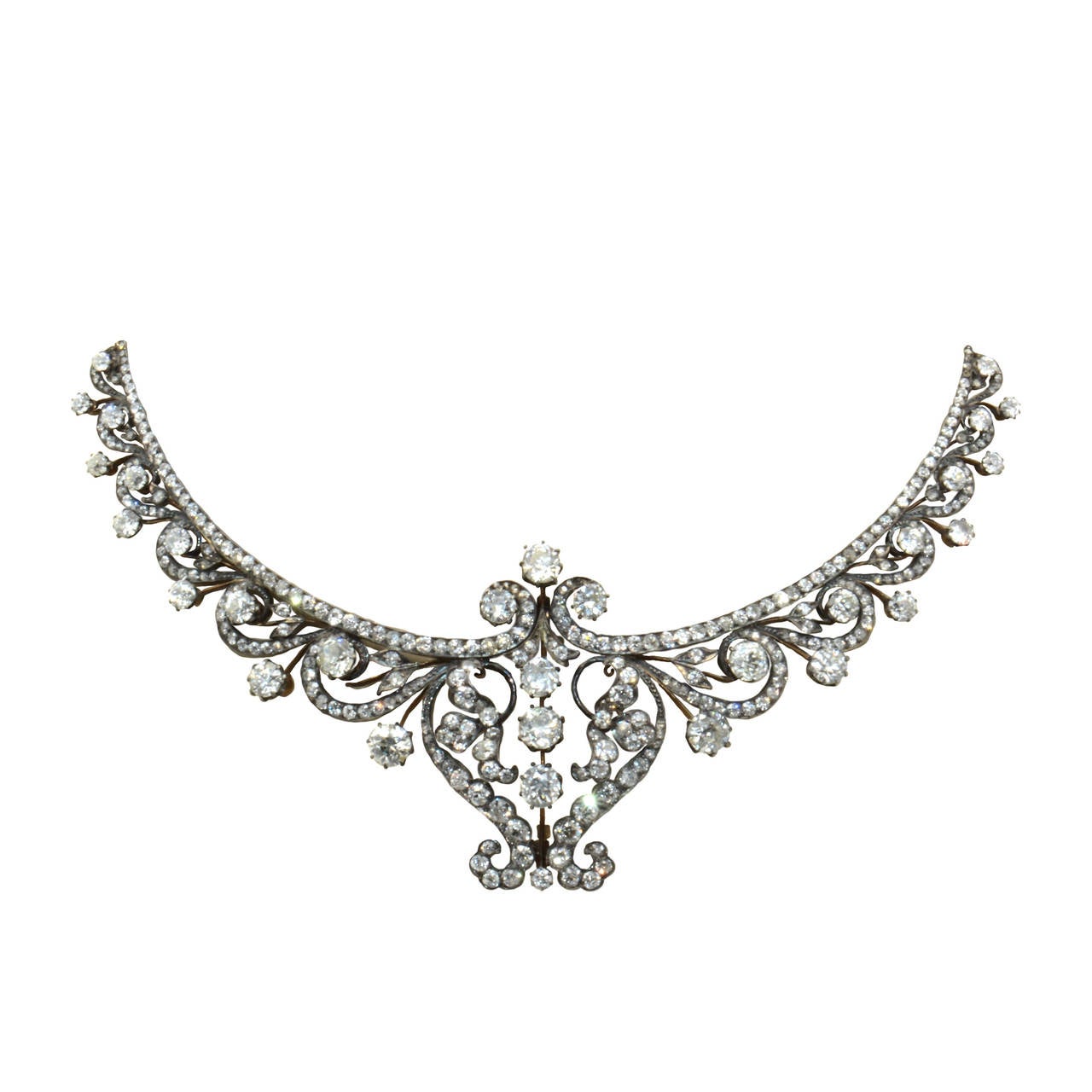 England, Victorian. Silver and silver gilt set with old cut diamonds. Used to be a tiara and transformed into a necklace. The added part from a later date. For more detailed information, please contact Massoni.