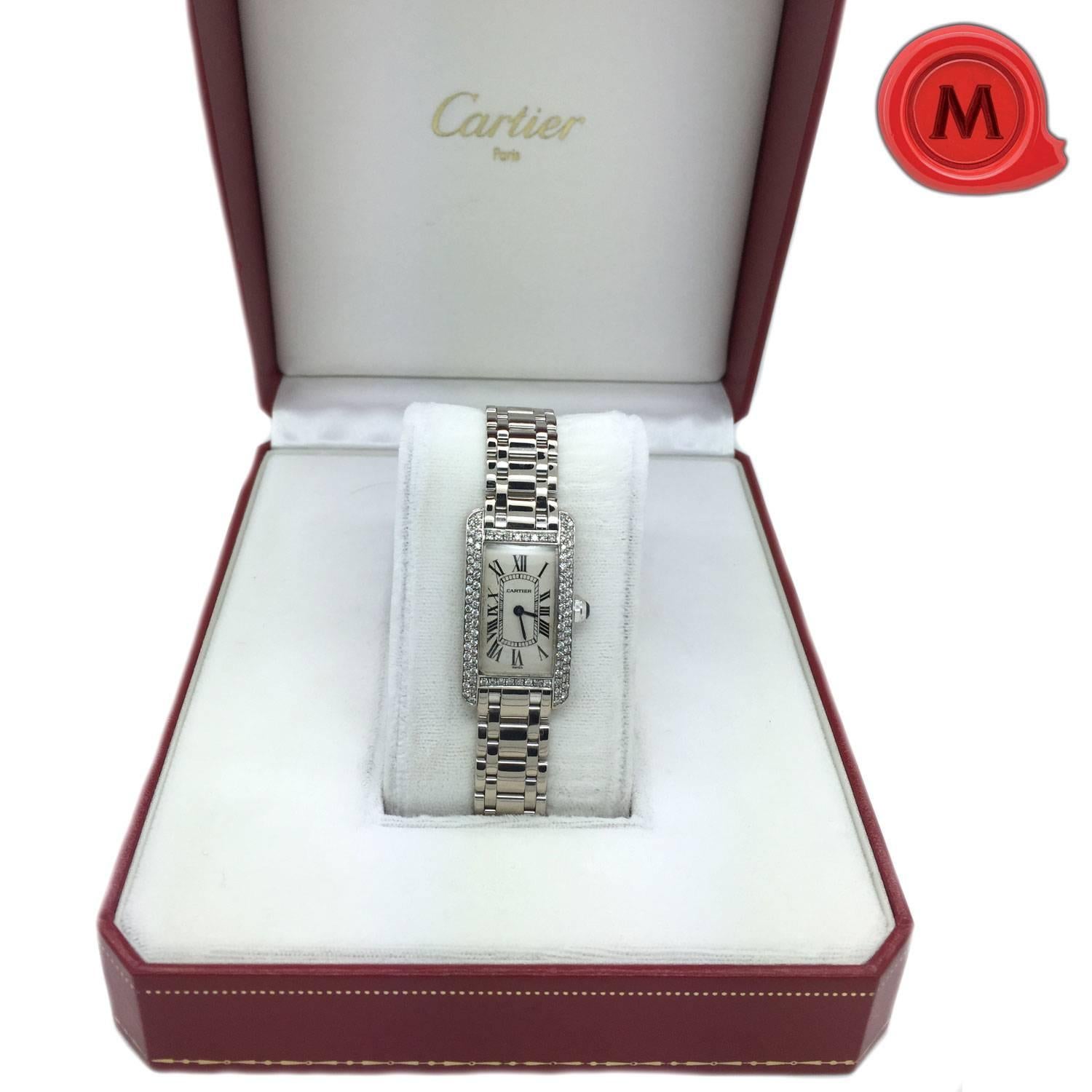 Cartier Tank Americaine lady´s watch in white gold 18K with diamond case and dial. Diamond bezel, roman numeral hour makers. Water resistant. Case 3.5 x 1.9 cm. Medium size. With original certificate and box. (Guarantee certificate 19.2.1999). This