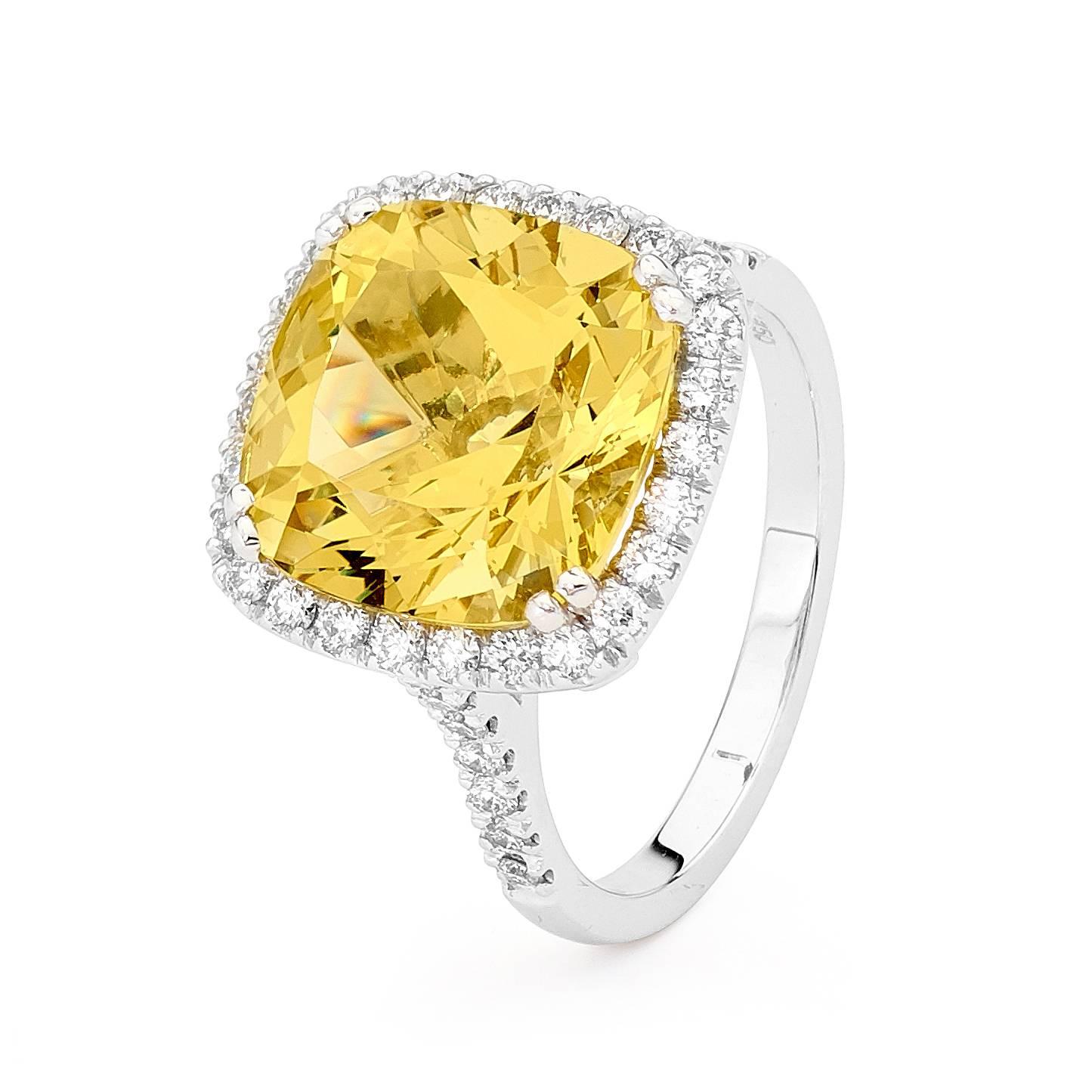 Our cushion cut Heliodor and Diamonds ring features a stunning 6.75ct cushion cut Heliodor gemstone at its centre (comes from Beryl's family), surrounded by 42 diamonds (weighing 0.59ct color FG / VS-SI), set with 18ct white gold to showcase the