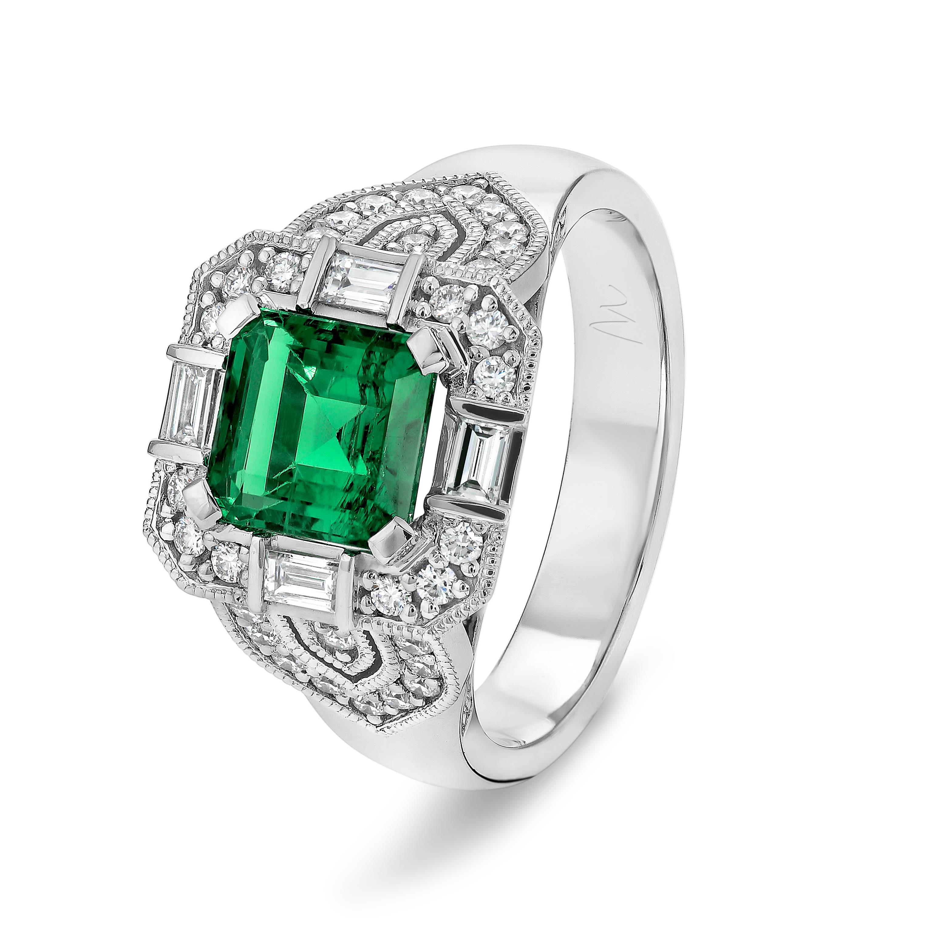 Our Art Deco style emerald and diamond ring features a 1.70ct Square Emerald Cut Emerald with 4 divine fine white baguette (weighing 0.186ct and color F-G / VS) and 70 round diamonds (weighing 0.47ct and color F-G / SI) set in 18ct White Gold with