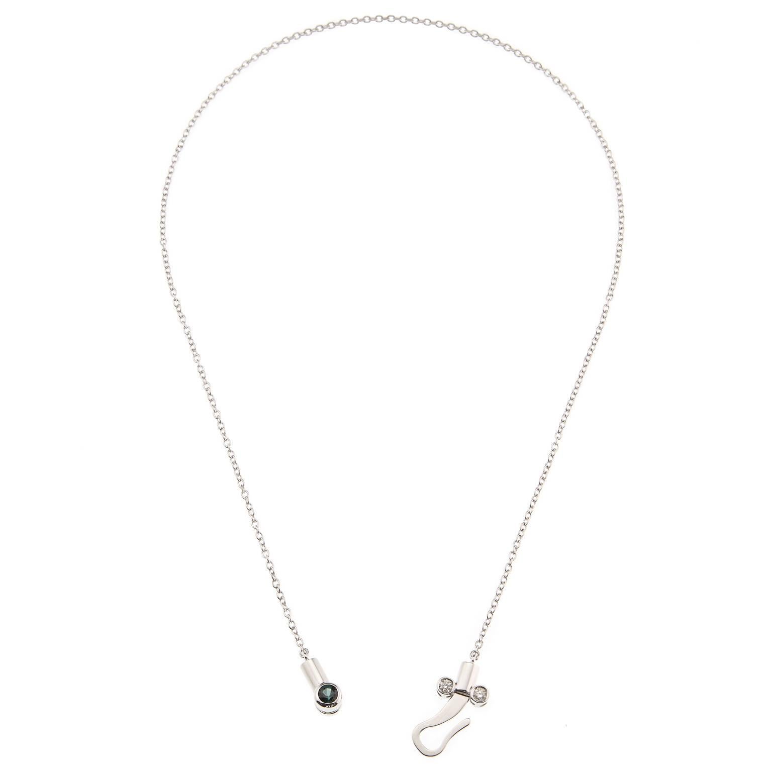 Micro pendant drop necklace in 18 karat white gold from the Microcosmos Series, is devised as a game, a construction or a sophisticated aerial mobile. Shapes attached to gold settings dangle lightly on the neck, their geometry pierced by diamonds