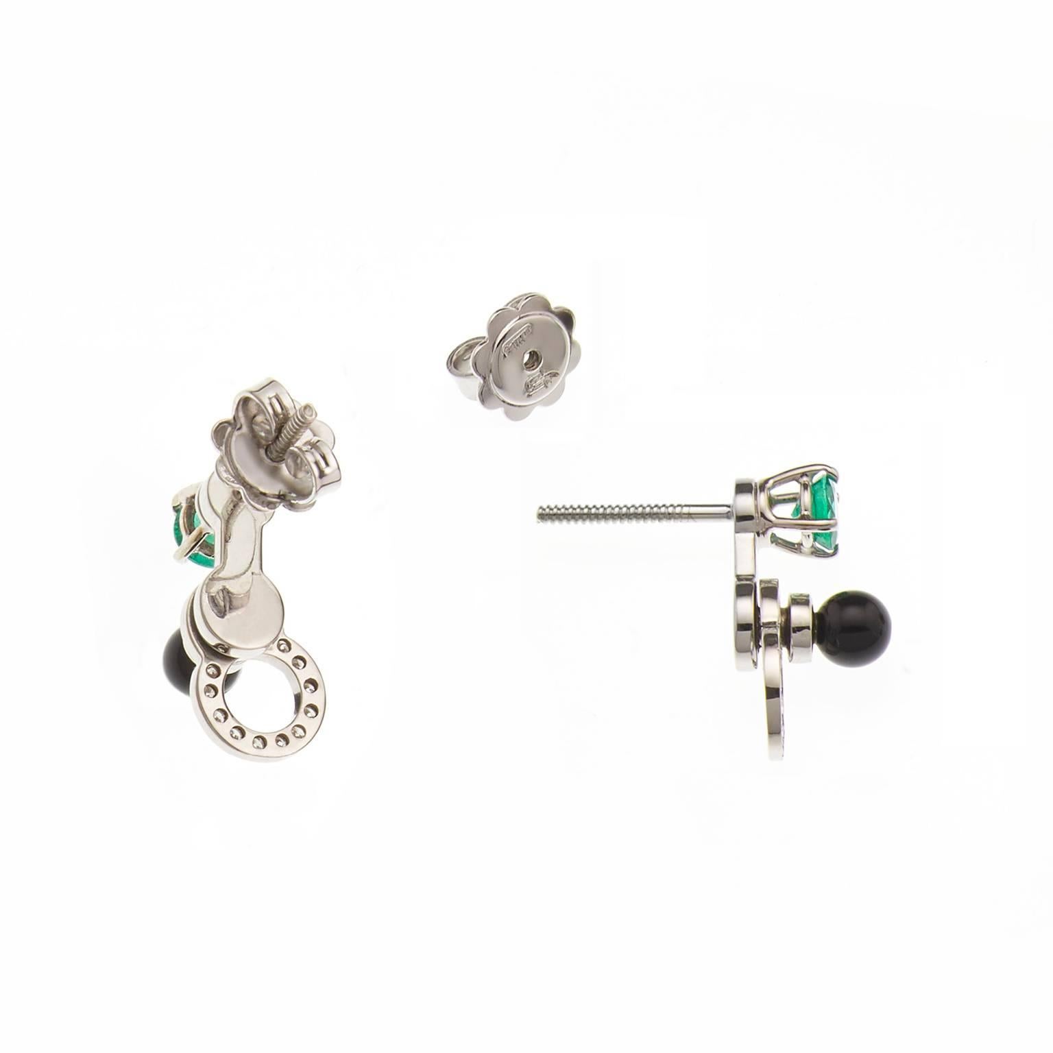 Cosmos drop earrings in 18 karat white gold from the Microcosmos Series, are devised as a game, a construction or a sophisticated aerial mobile. Shapes attached to gold rings dangle lightly on the ear, their geometry pierced by diamonds (0,11
