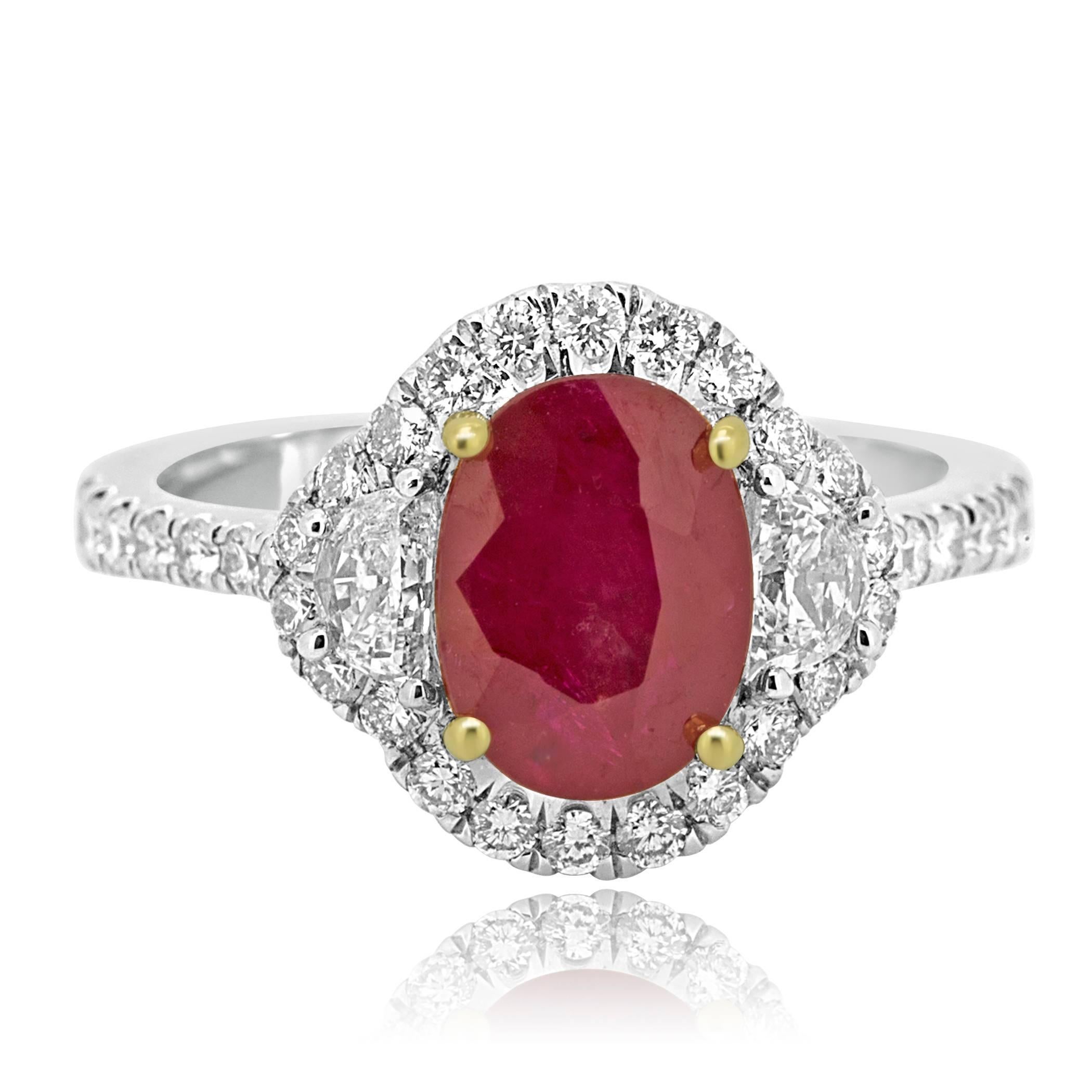 1 Ruby Oval 2.35 Carat encircled in Halo of White Colorless VS-SI Clarity Round Diamond 0.57 Carat Flanked by 2 Half moon G-H Color VS-SI  Diamonds 0.32 Carat in 18K White and Yellow Gold Three Stone Bridal Fashion Cocktail Ring. 

Style available
