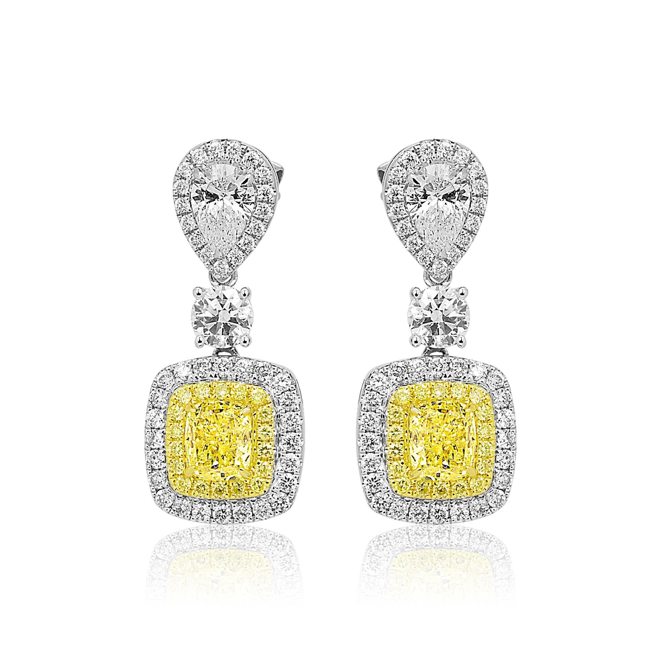 2 Natural Fancy Yellow Cushion 2.03 Carat Encircled in double Halo of Natural Fancy Yellow Rounds 0.24 Carat encircled in White Diamond Round 1.24 Carat 2 Diamond Pear shape 0.84 Carat in 18K White and Yellow Gold Dangle Drop lever back