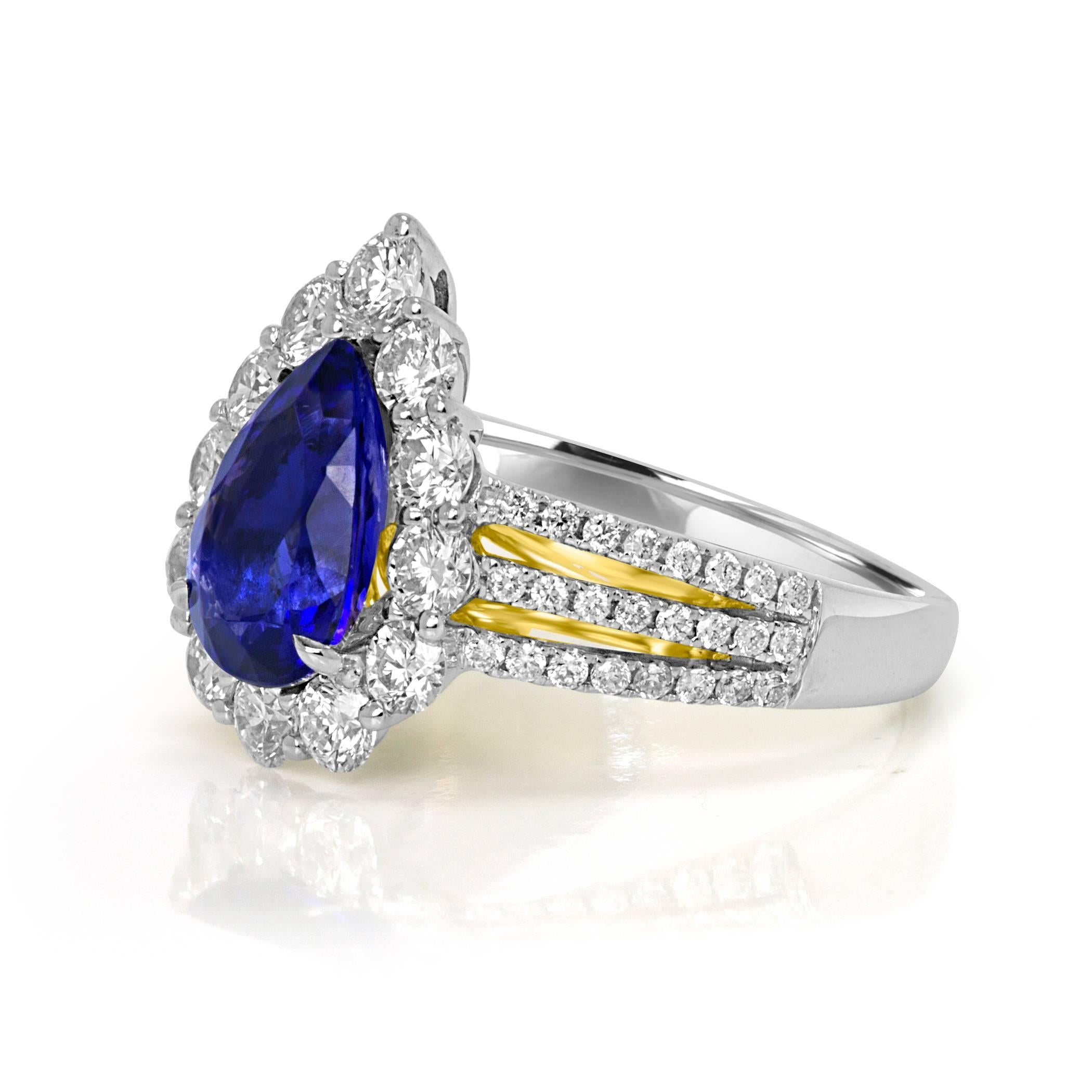 Tanzanite Pear Shape 2.44 Carat encircled in a Halo of White Diamonds 1.30 Carat with a three prong shank with White Diamonds 0.35 Carat In 18K white and yellow Gold Fashion Cocktail Ring. 

Style available in different price ranges. Prices are