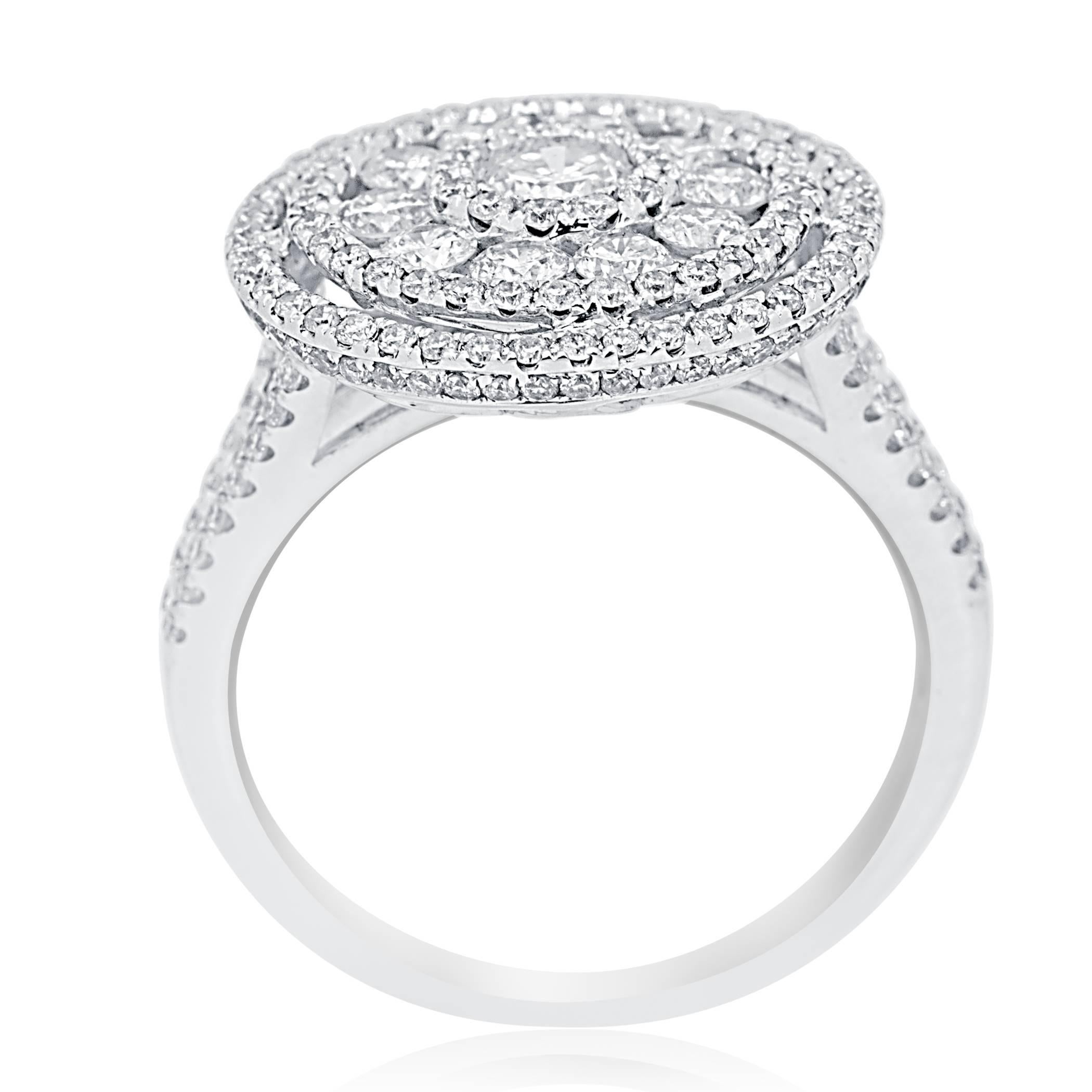 Stunning Big look Disc Style White Diamonds G-H Color SI clarity Rounds 1.65 Carat total weight set in 14K White Gold in cluster look micro pave Cocktail fashion ring perfect for all occasions and events.

Total Diamond Weight 1.65 Carat