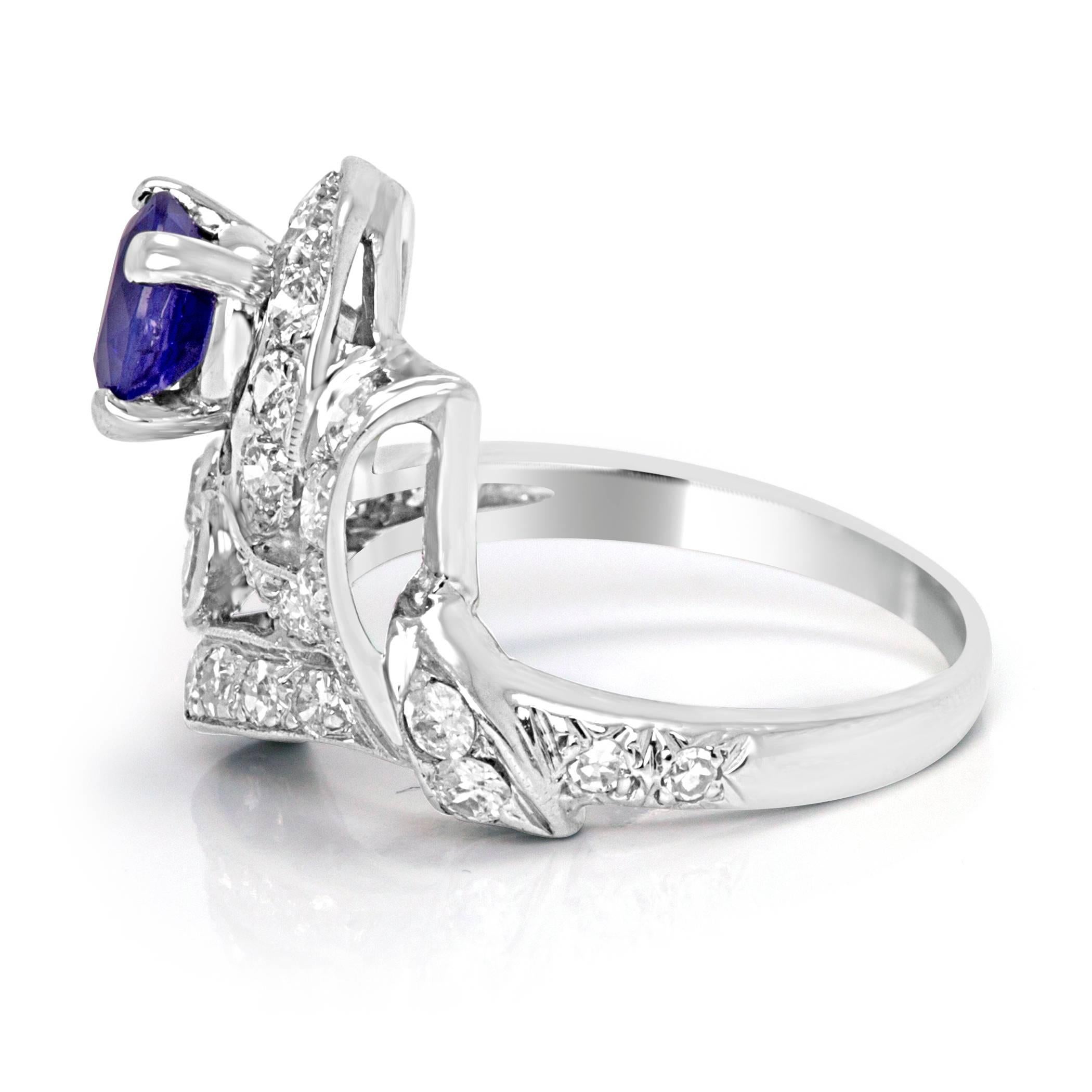 1.10 Carat Heated Blue Sapphire round with white diamond round approximate 0.45 carat total weight in Platinum Art Deco  Ring.