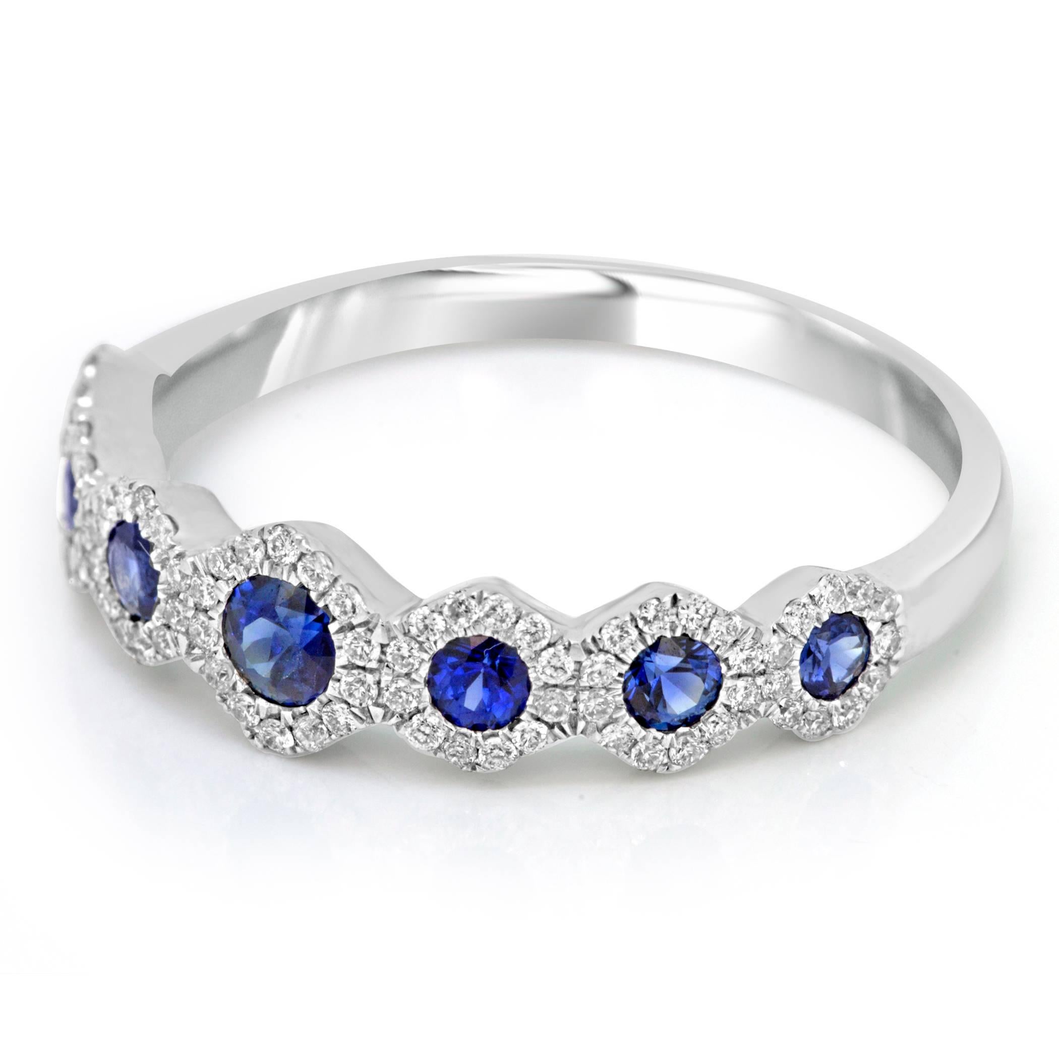 Blue sapphire round 0.62 Carat encircled in halo of white Round diamonds 0.43 Carat in 14K White gold everyday wear Stackable Fashion band ring.

Total Blue Sapphire Weight 0.62 Carat
Total Diamond Weight 0.43 Carat

Style available in different
