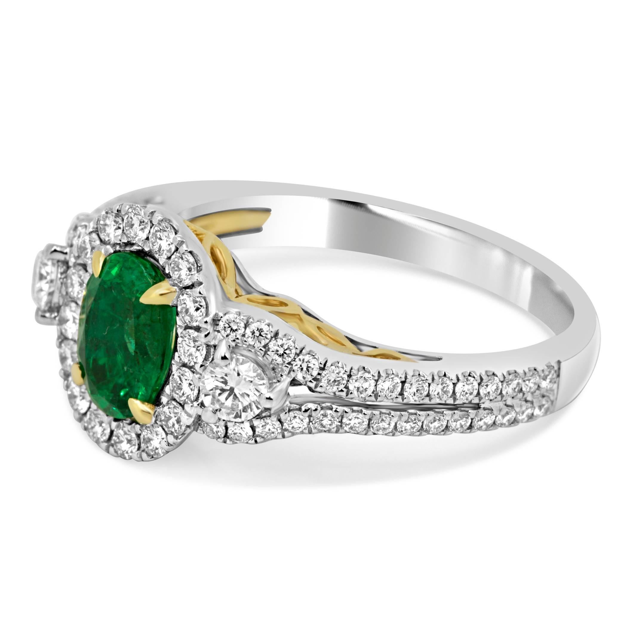 Emerald Oval 0.70 Carat encircled by a halo of White Round Diamonds 0.47 Carat and flanked by Two Round  White diamonds on the side 0.16 Carat in 14k White and Yellow gold Ring Three Stone Bridal and Fashion Ring.

Style available in different price