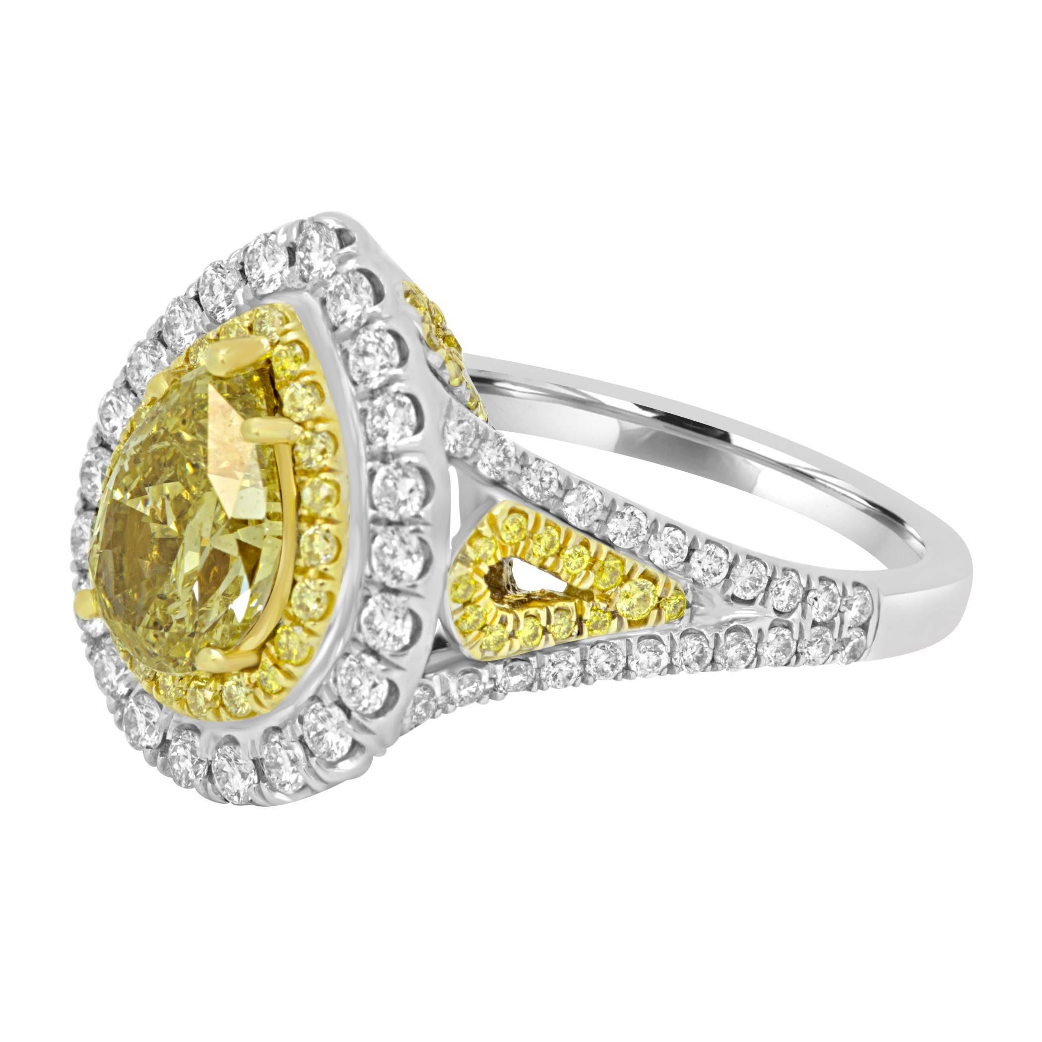 GIA Certified Natural Fancy Intense Yellow Pear shape Diamond  1.26 Carat Encircled in a Double Halo of of Natural Fancy Yellow Round Diamond 0.36 Carat and Natural White Diamond 0.59 Carat in a beautiful Handcrafted Two Color 18K White and Yellow