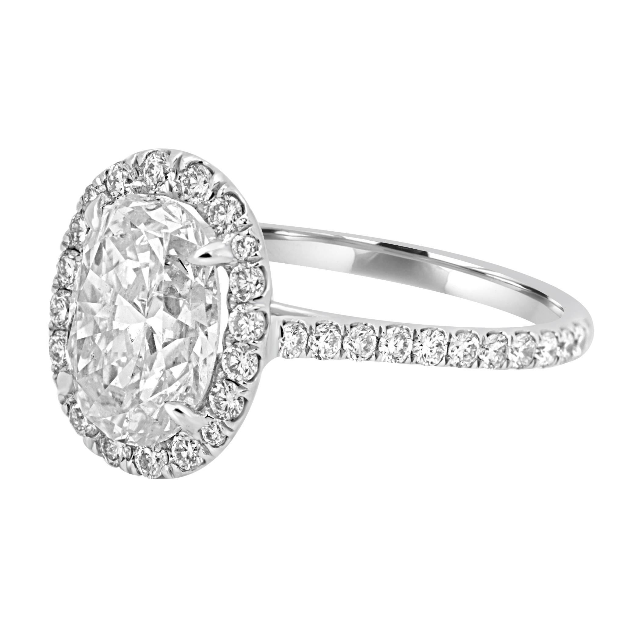 EGL USA Certified I Color SI2 Clarity Oval Diamond 2.48 Carat penciled in a Halo of Natural White Diamond 0.60 Carat in a Beautiful Delicate Handmade Bridal 18K White Gold Ring.

MADE IN USA

Total Diamond Weight 3.08 carat
MATCHING BAND