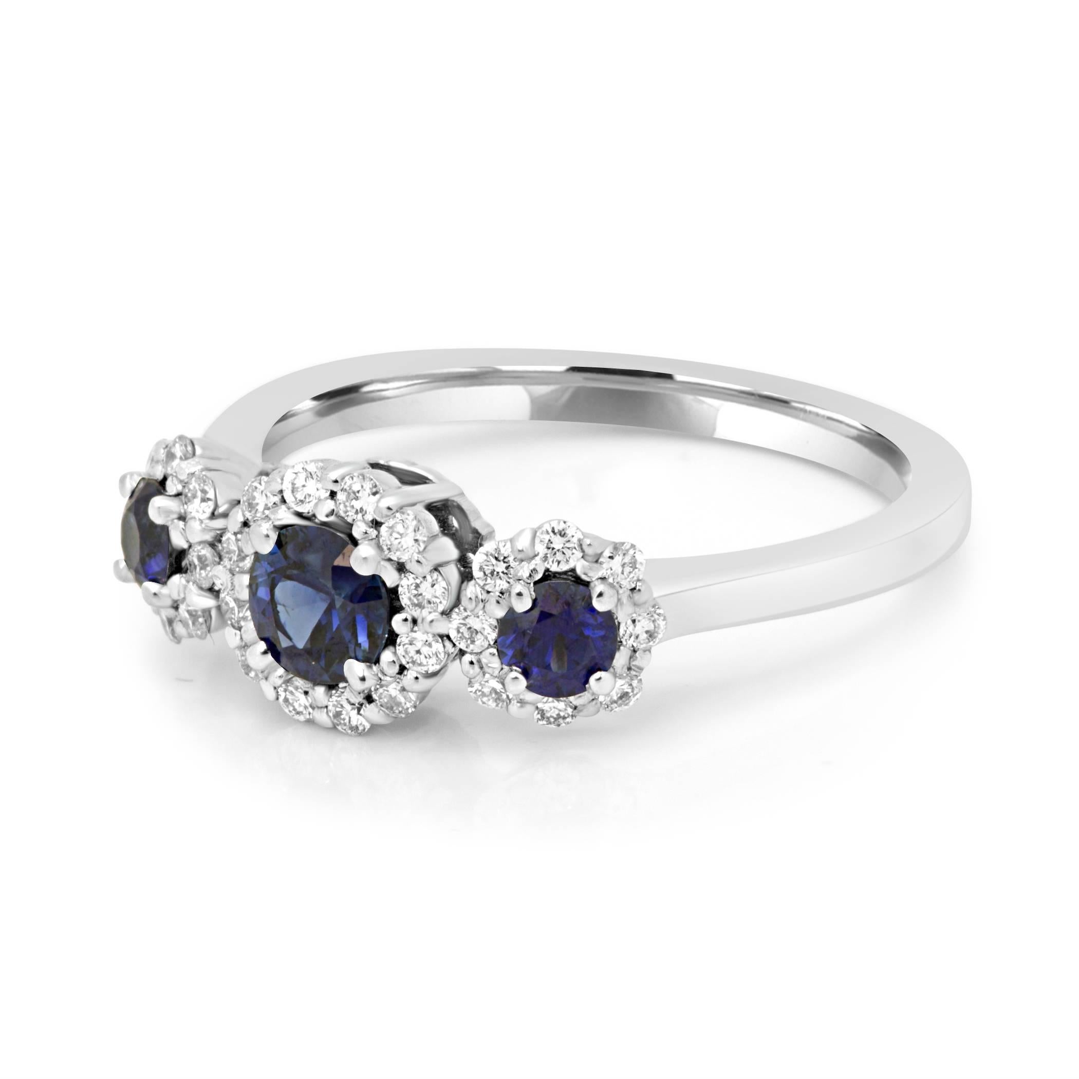 3 Natural Blue Sapphire Round 0.62 Carat Encircled in Halo of White Diamond Round 0.28 Carat in 14K White Gold Three Stone Fashion Cocktail Ring perfect for everyday wear.

MADE IN USA.

Total Stones Weight 0.90 Carat

Style available in different