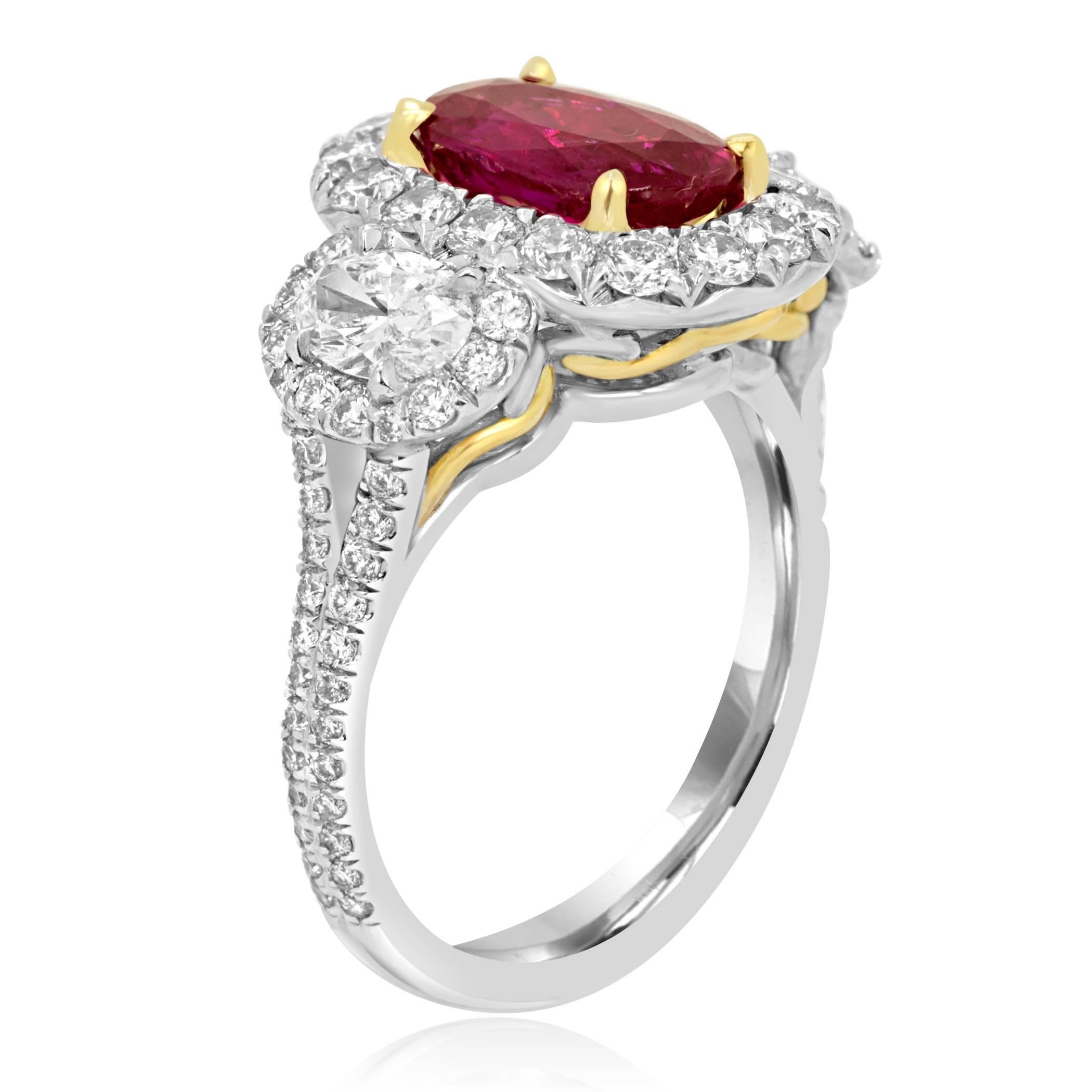 Gorgeous and Rare GIA Certified No Heat Burma Ruby Oval 2.10 Carat encircled in a single Halo of White Diamond Round 1.20 Carat Flanked by 2 White Diamond Oval 0.64 Carat in a stunning Three stone With Halo 18K White and Yellow Gold Fashion Cocktail