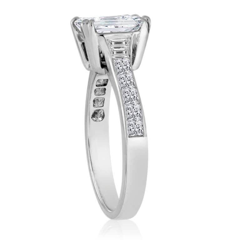 White Emerald Cut Diamond 2.02 Carat VVS-VS clarity Flanked By White Diamond Trapezoid and Princess Cut Diamond on the side 0.58 Carat in 18K White Gold Classic Bridal Ring.

Style available in different price ranges. Prices are based on your