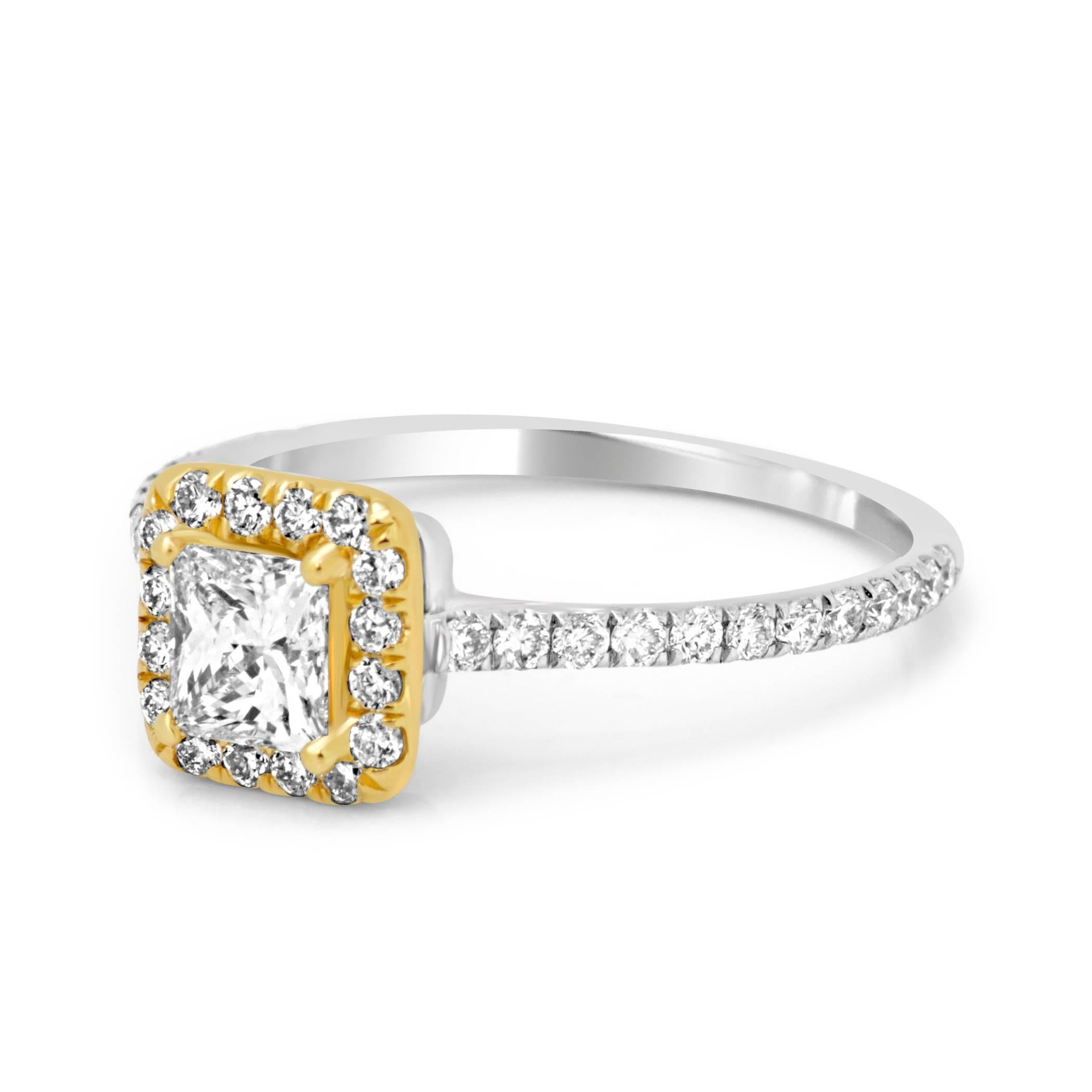 0.45 Carat Princess Cut Diamond G-H Color VS Clarity encircled in a single Halo of White Round G-H Color VS-SI Clarity Diamonds 0.36 Carat in a Chic and Delicate Handmade Classic 18K White and Yellow Gold Ring.

MADE IN USA
Total Diamond Weight 0.81