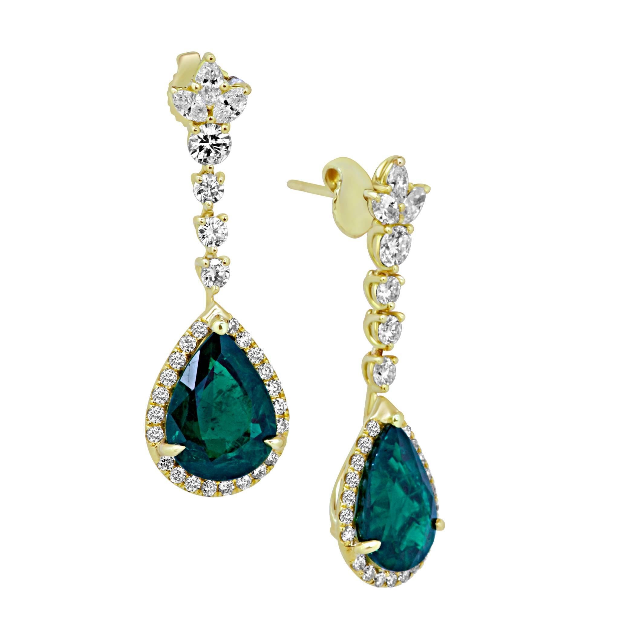 Very Rich Color Natural Emerald Pearshapes 7.06 Carat encircled in White Diamond Round Halo 1.12 Carat With 3 White Diamond Marquis on top 0.47 Carat in 18K Yellow Gold exquisite one of a kind Handmade  Earring.

MADE IN USA
Total Stones Weight 8.65