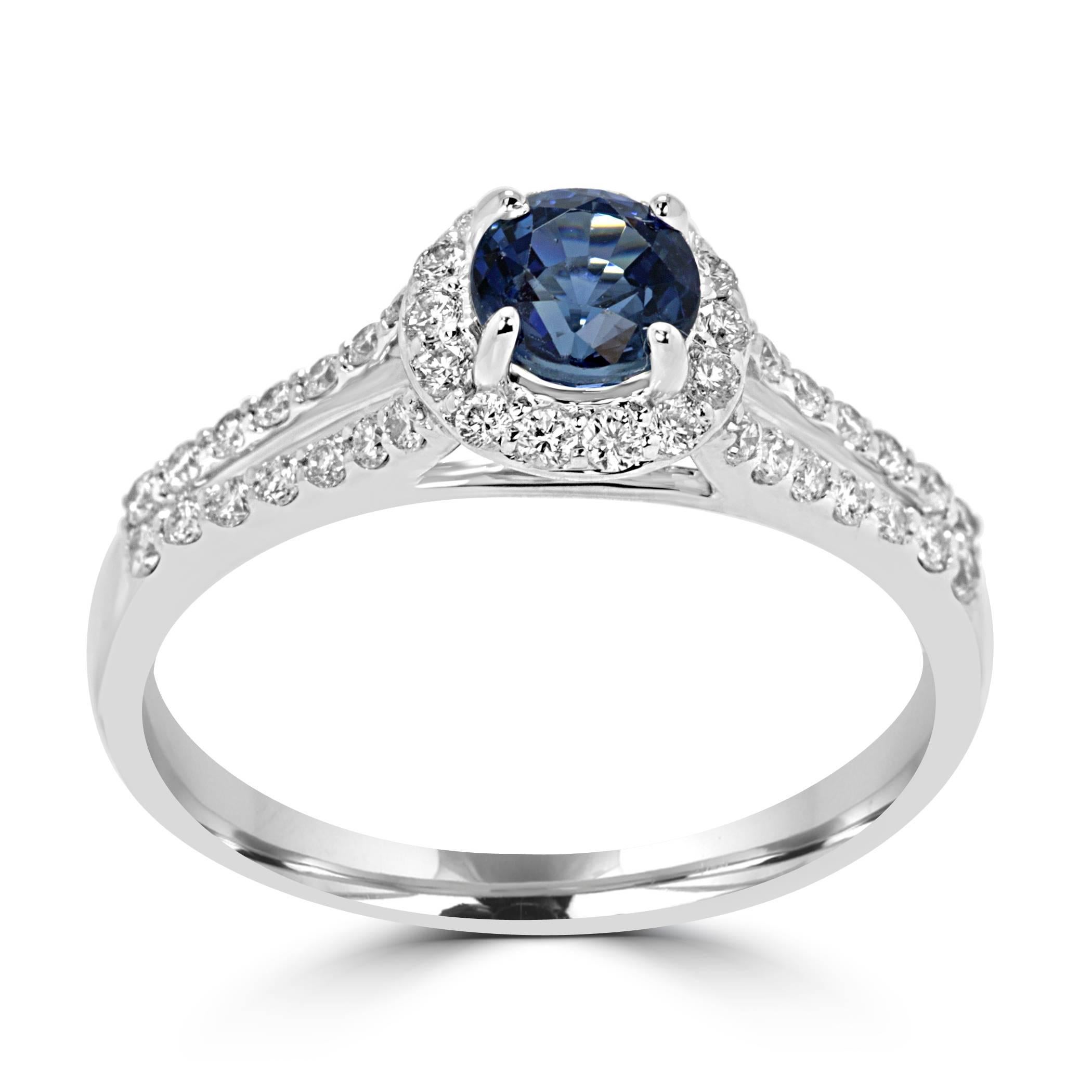 Sapphire Round Diamond Cut 0.79 Carat Encircled in White Diamond Round 0.40 carat in a simple and classic split shank 14K White Gold Ring.

Total Stone Weight 1.19 Carat