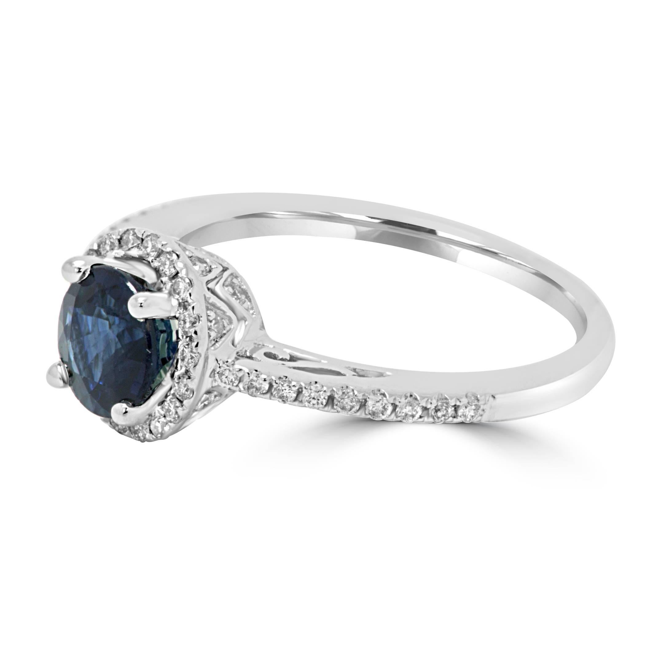 Blue Sapphire Round Diamond Cut 1.31 Carat encircled in a single halo of white G-H Color SI Clarity diamond round 0.30 Carat in a Simple classic 14K  White Gold Bridal Fashion Cocktail Ring.

Style available in different price ranges. Prices are