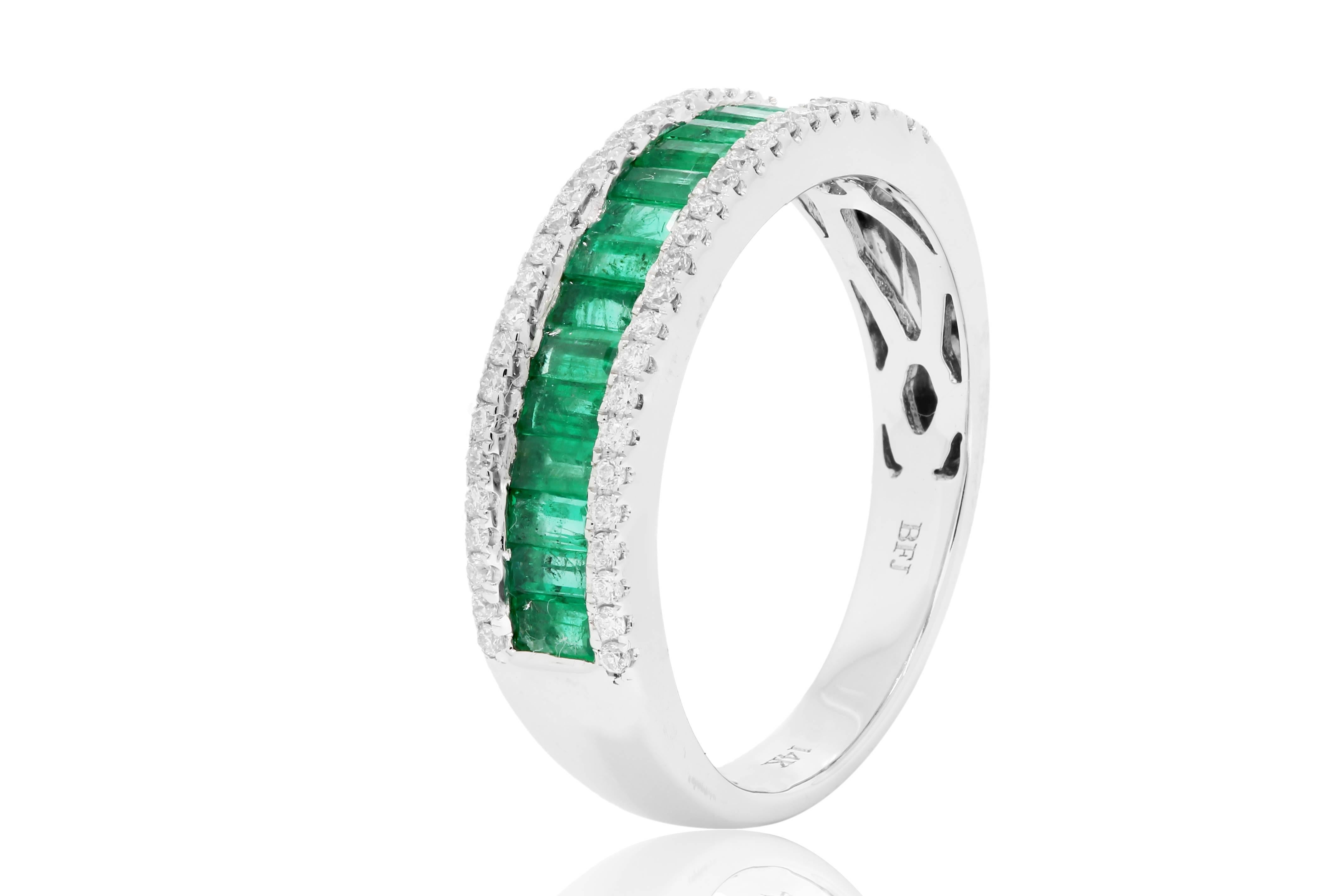 Emerald Baguettes 0.82 Carat Flanked by white diamond rounds on side 0.20 Carat in 14K White Gold Band Ring.

Total Stone Weight 1.02 Carat