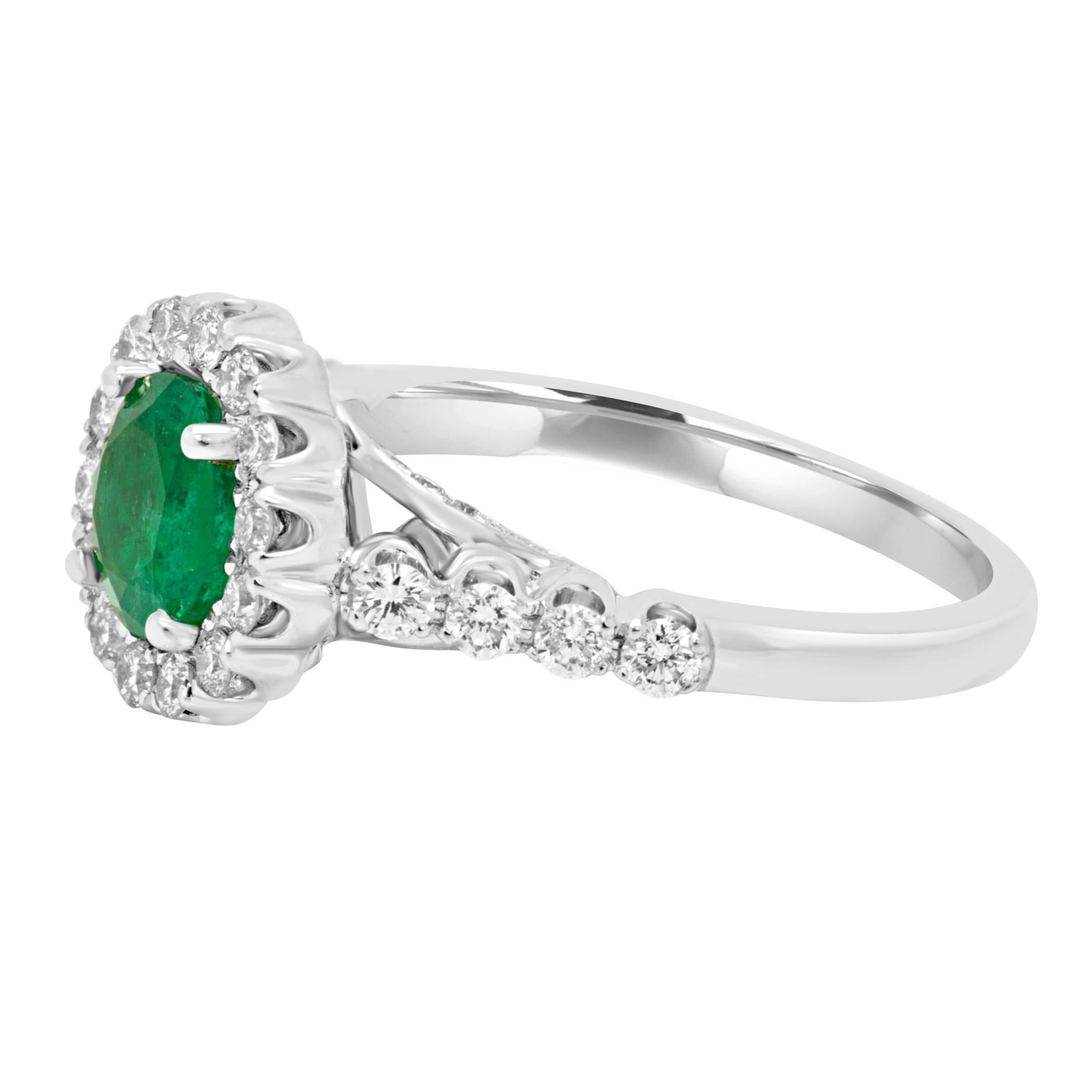 Stunning Emerald Round 1.08 Carat encircled in a halo of white G-H Color VS-SI Clarity diamond rounds 0.75 Carat Set in 18K White Gold Bridal Fashion Cocktail Ring.

Style available in different price ranges. Prices are based on your selection of