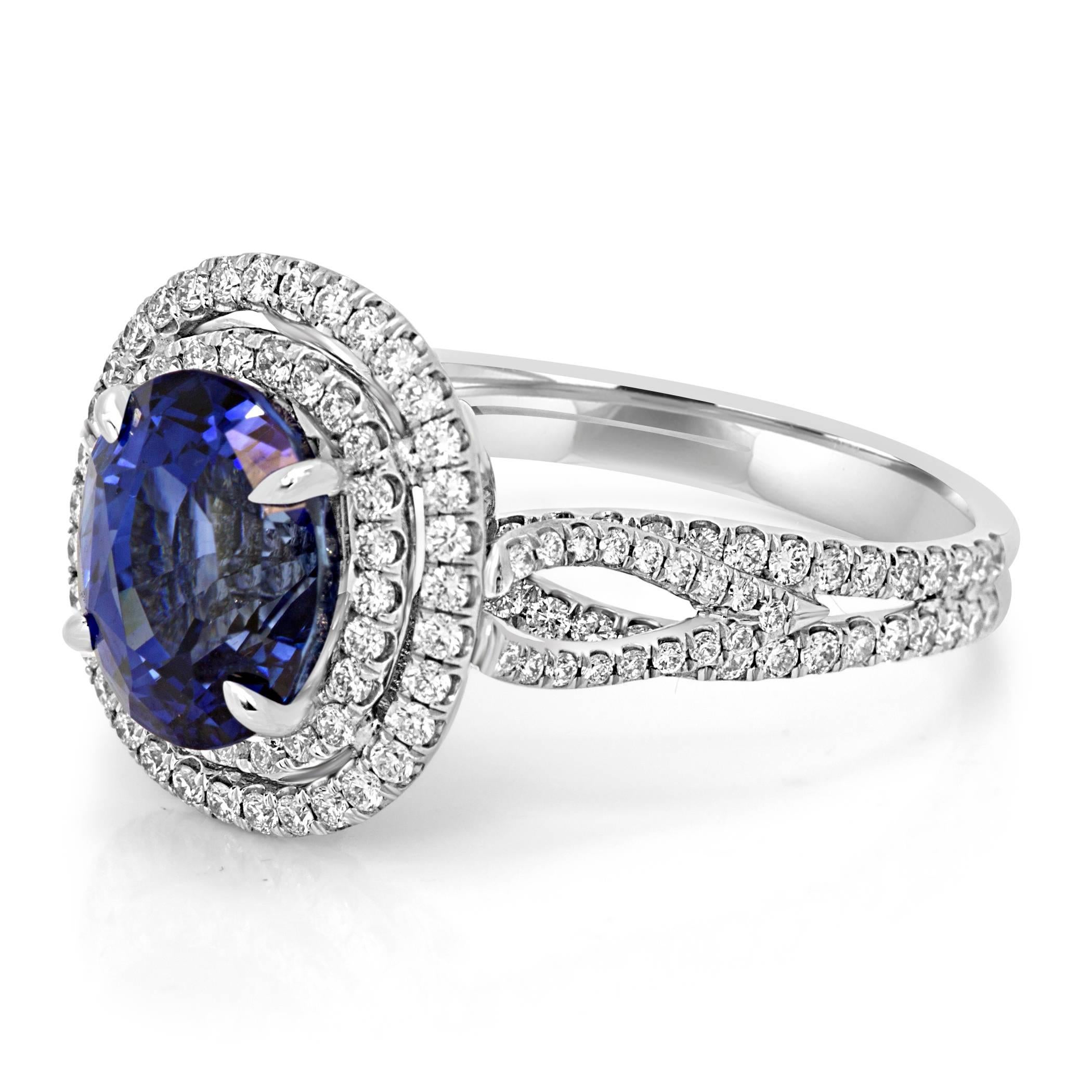 Stunning GIA Certified 4.30 Carat Oval Blue Sapphire encircled in a Double Halo of Round White Diamonds 1.00 Carat in a very Classy and Intricately made 18K White Gold Ring.

Style available in different price ranges. Prices are based on your