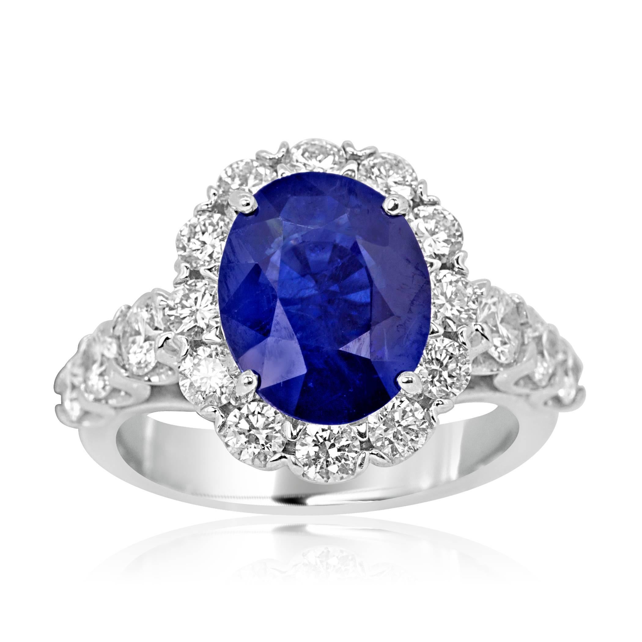 GIA Certified Stunning Blue Sapphire Oval 3.81 Carat Encircled in a Halo of White G-H Color VS-SI Diamond 1.45 Carat in 18K White Gold Bridal Fashion Cocktail Ring. 

Style available in different price ranges. Prices are based on your selection of