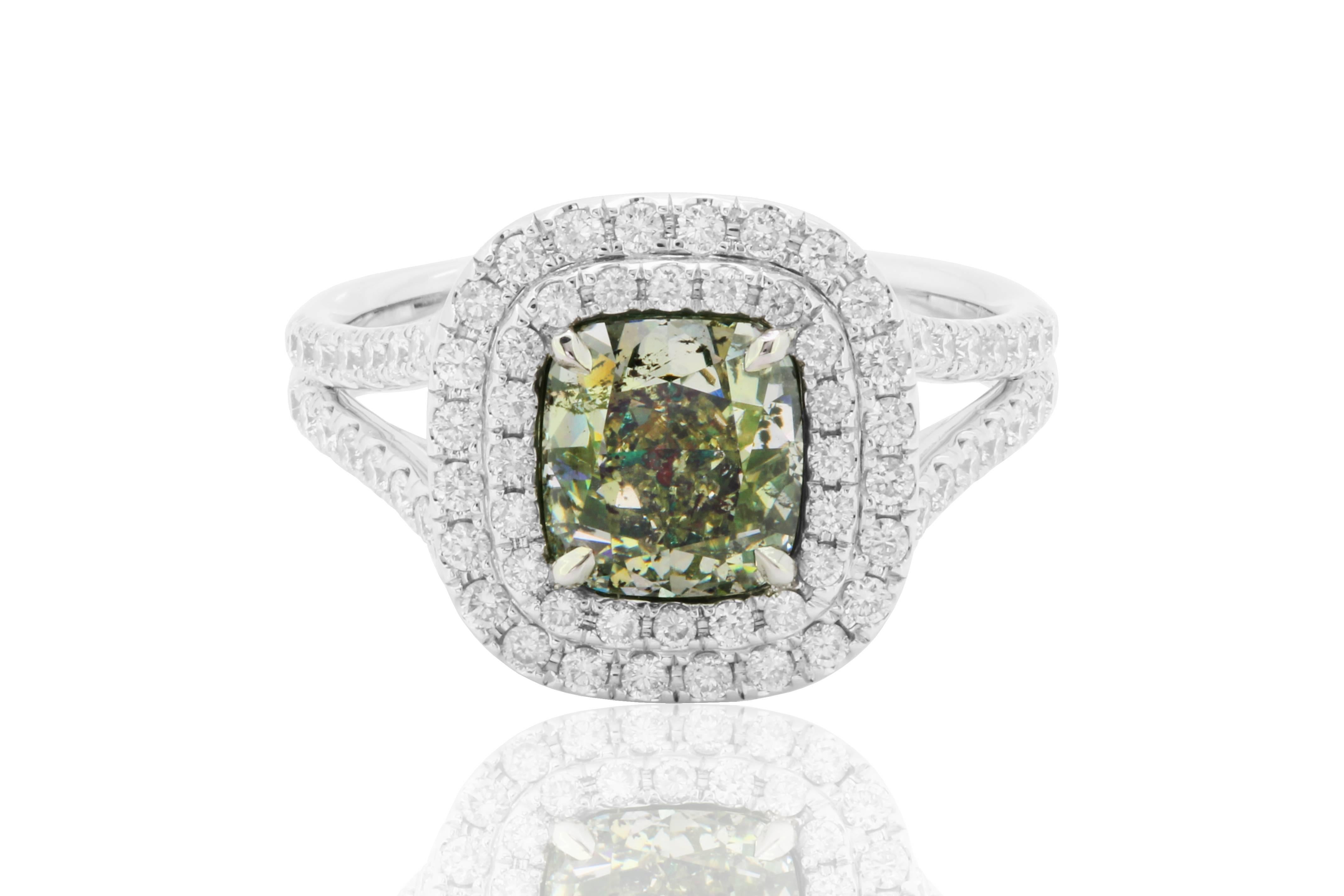 Very Rare GIA Certified Natural Fancy Grayish Yellowish Green Cushion Diamond 2.05 Carat Encircled in a Double Halo of White Diamond Rounds 0.61 Carat in a handmade 18K White Gold Ring.
MADE IN USA.
Total Diamond Weight 2.66 Carat