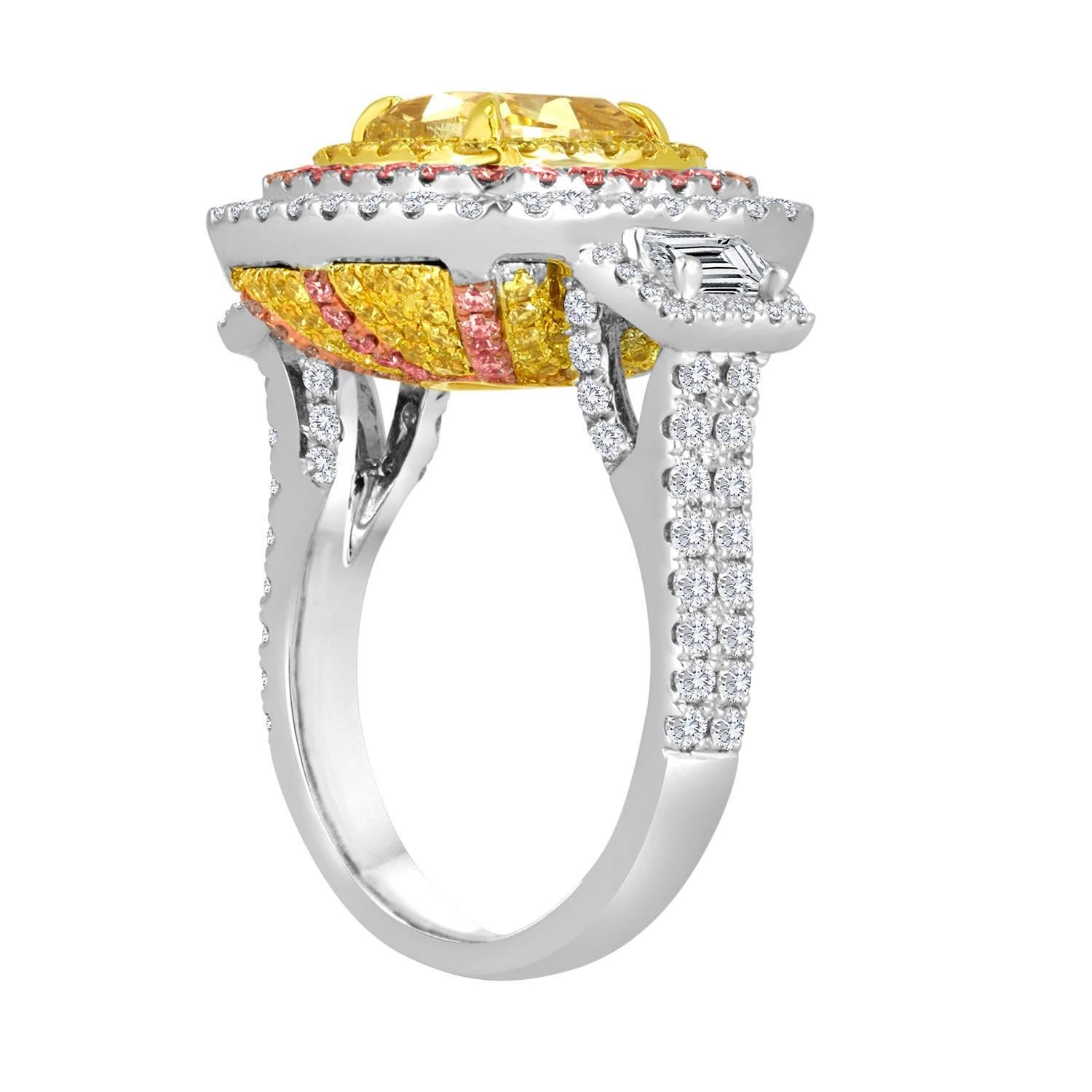 A Gorgeous exquisite Hand Made GIA Certified 2.53 Carat Natural Fancy Light Yellow VVS2 encircled in a triple Halo Natural Fancy Yellow Round Diamonds 0.80 Carat, Natural Fancy Pink Round Diamonds 0.50 Carat and Natural White Round Diamonds 0.93