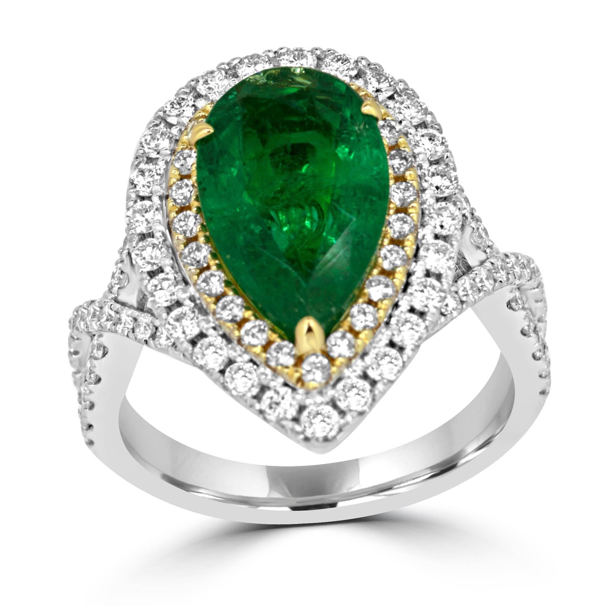 Emerald Pear Shape 2.79 Carat encircled in White Diamond Rounds 0.90 Carat in 14K White and Yellow Gold Twist Split shank Ring.

Total Stone Weight 3.69 Carat