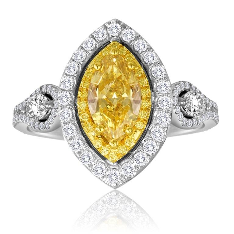 GIA Certified Vivid Yellow looking Fancy Intense Yellow Marquise 1.10 Carat encircled in Double Halo of Natural Fancy Yellow Round Diamonds 0.23 Carat and White Round Diamonds 0.75 Carat  flanked by 2 White Diamond Marquise on the side 0.31 Carat in