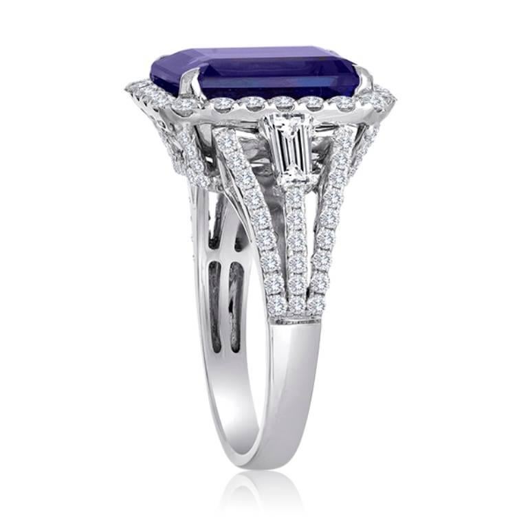 Stunning 5.67 Carat Emerald Cut Natural Tanzanite encircled in a single Halo of White Round Diamonds 1.13 Carat Flanked by 2 White Diamond Tapers on the side 0.32 Carat in 18K White Gold intricately made Ring.

Style available in different price