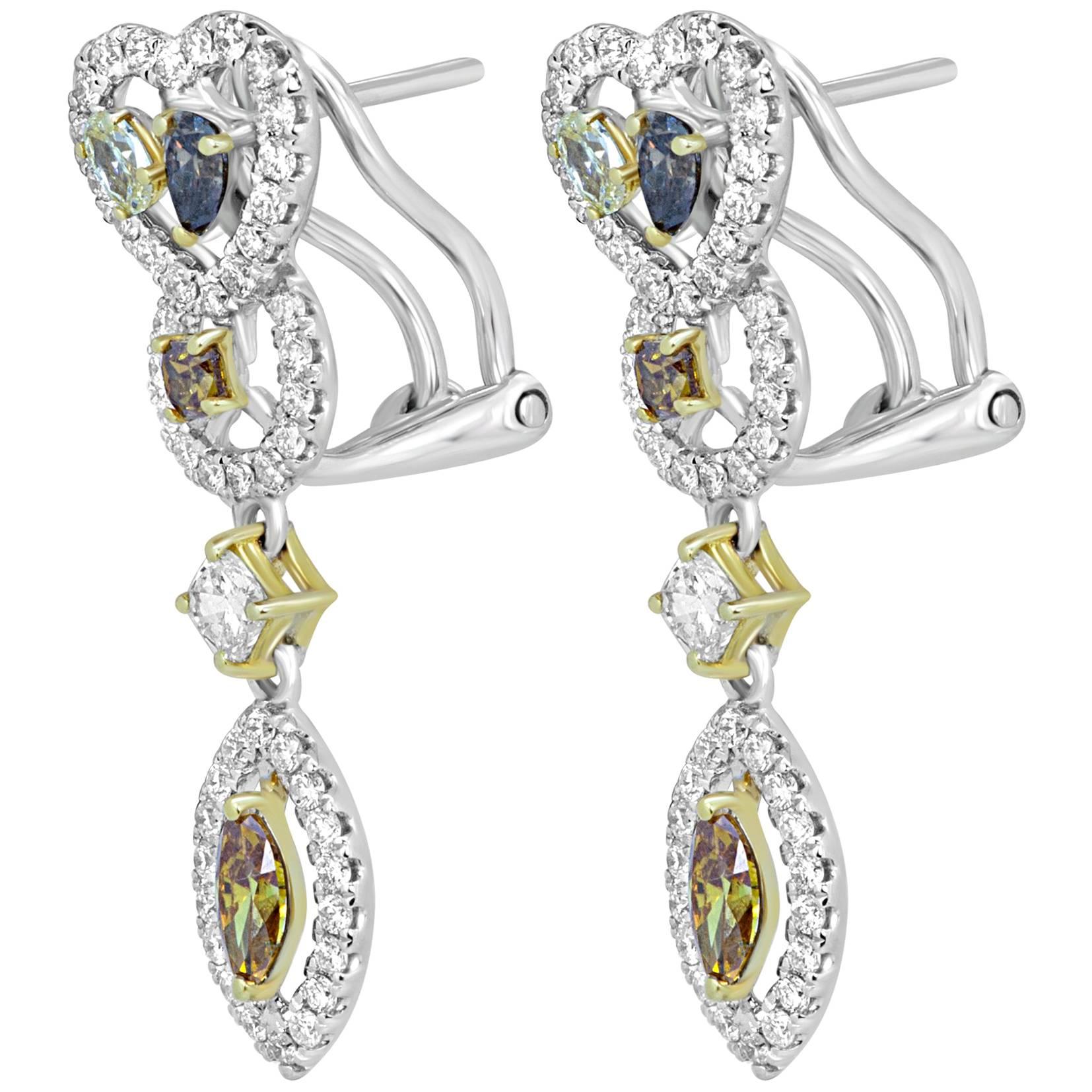 Beautiful 10 Multicolored and Mix Shapes Natural Fancy color Diamonds 1.31 Carat Encircled in a single Halo of White Round Diamonds 0.73 Carat in 18K White and Yellow Gold One of a Kind Earring.

Total Diamond Weight 2.04 Carat