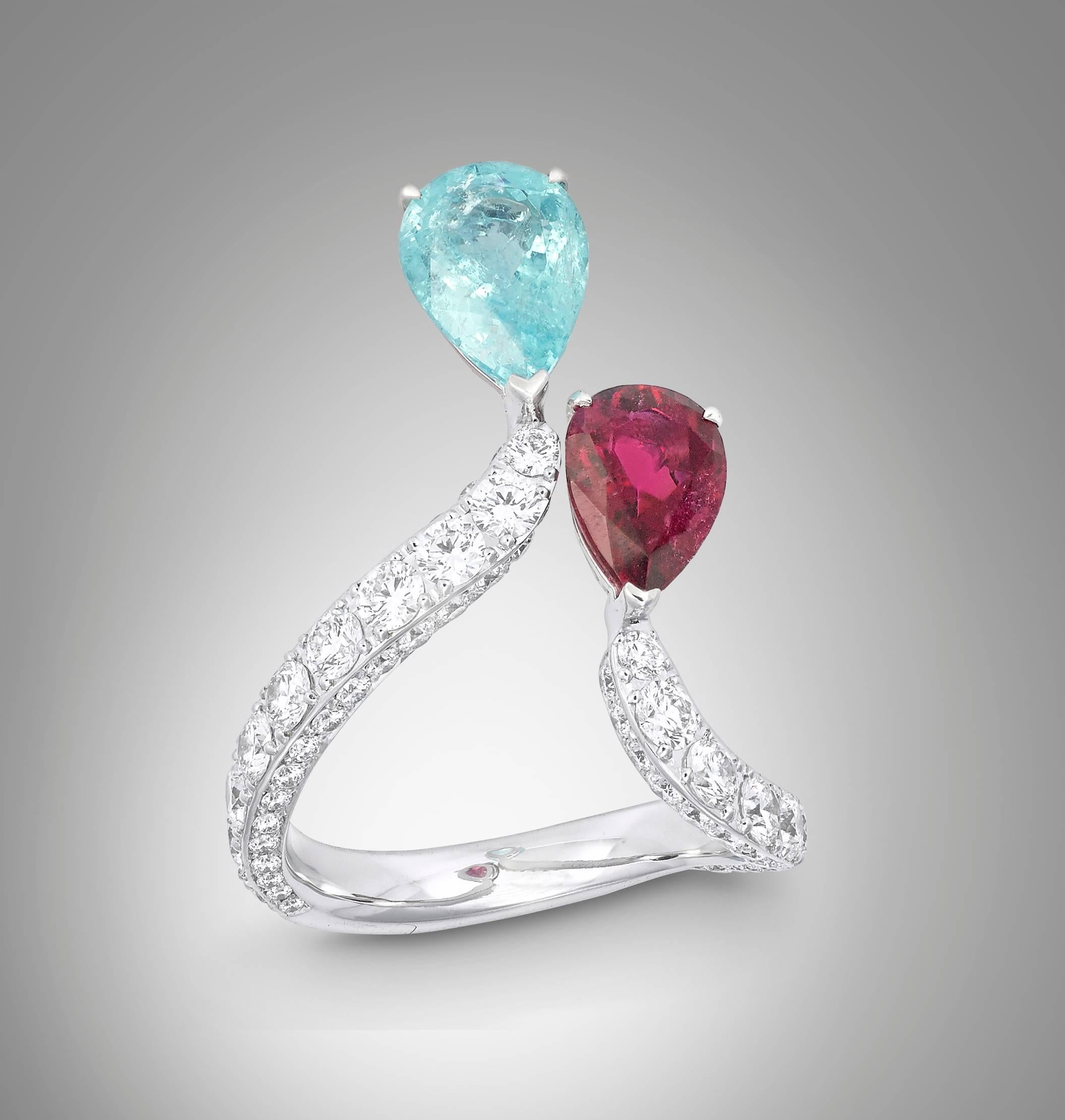 Toi et Moi ring crafted in 18K white gold                           
Round brilliant diamonds = 1.906 carats                                  
Pear shaped brazilian paraiba tourmaline = 1.8                       
Pear shape African rubelite         