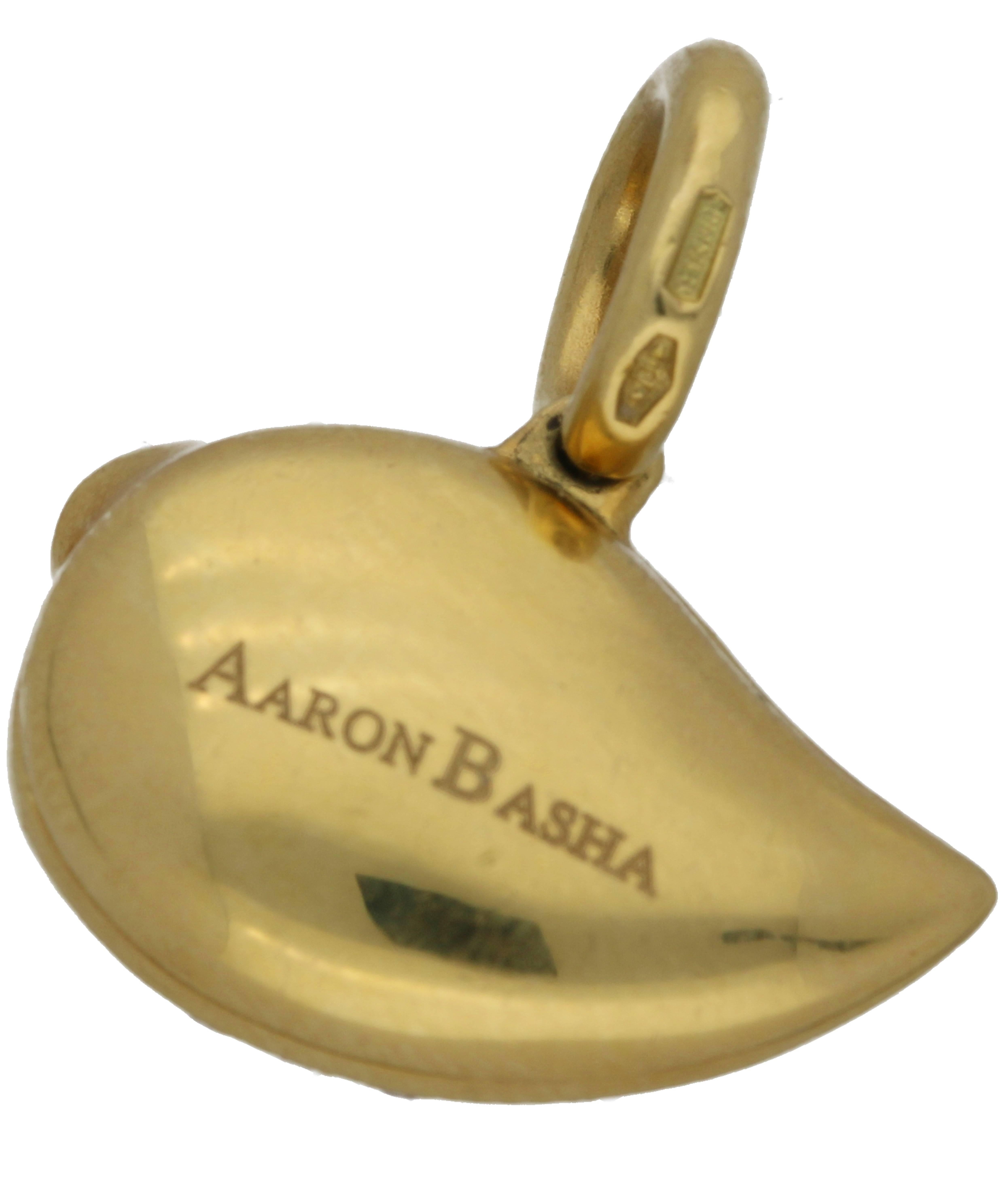 An 18ct yellow gold charm by the designer Aaron Basha, set with 21 round brilliant diamonds approx 0.03ct each with vibrant fine enamel work.