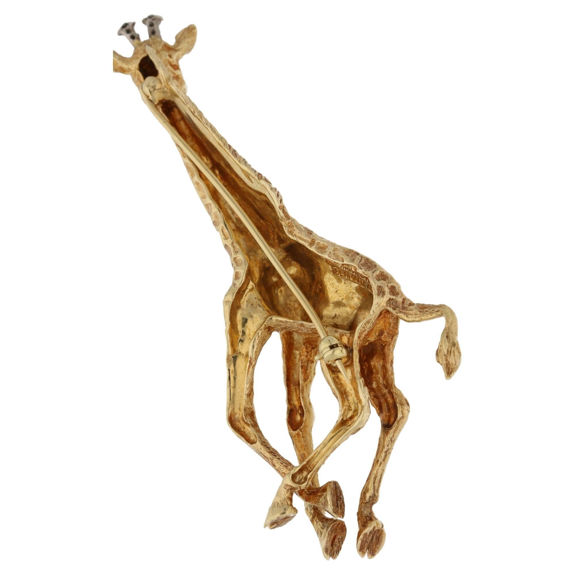 A diamond and sapphire set giraffe brooch, by Tiffany&Co. The giraffe is finely textured, in mid gallop, set with brilliant-cut diamond horns and circular-cut sapphire eyes. Length 7.5 cm, signed ‘Tiffany&Co. 1989, Germany’.