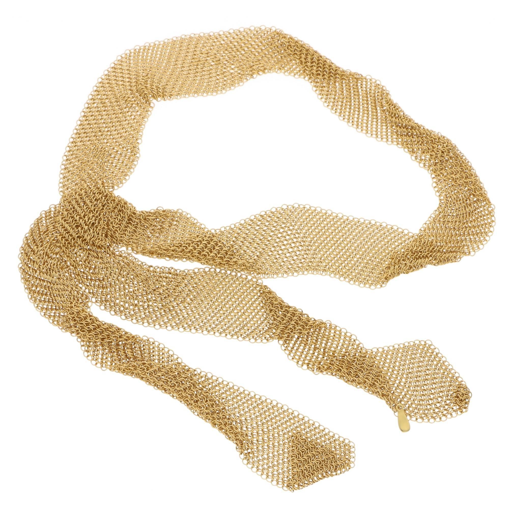 A truly exceptional Tiffany & Co. 18 carat yellow gold mesh necklace by Elsa Peretti. The exquisite necklace is intricately designed in the form of a scarf which tapers diagonally at each end. This exceptional piece is extremely flexible and can be