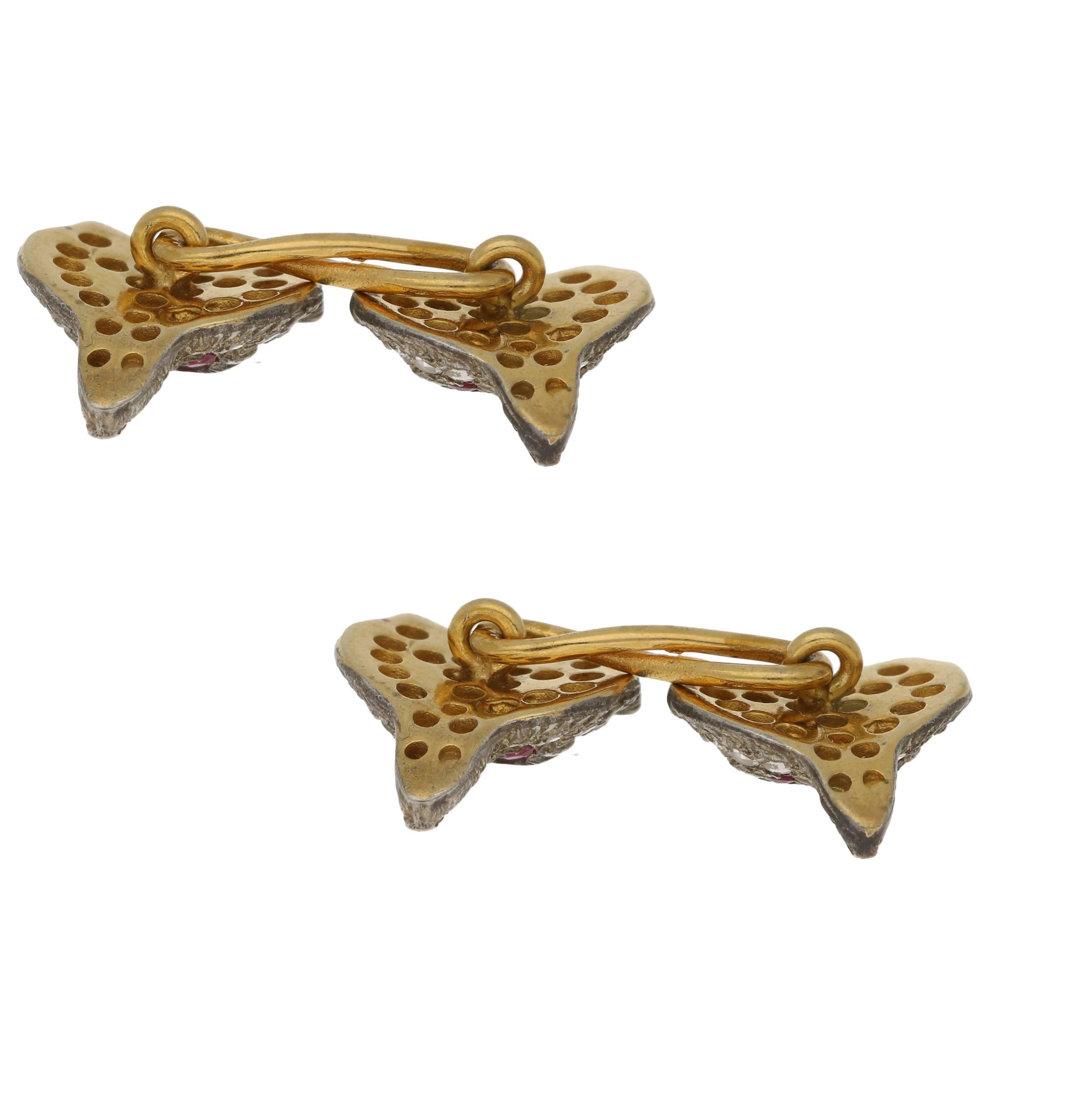 A pair of Victorian 18ct gold and silver fox's head cufflinks. Each head is pave set with 26 rose cut diamonds and with 2 round fauted ruby eyes. The fox's heads have beautiful intricate engraved detailing for the fur on his face, ears, nose and