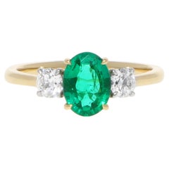 Contemporary 1.86ct Oval Emerald and Diamond Three Stone Ring