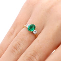 Contemporary 1.86ct Oval Emerald and Diamond Three Stone Ring